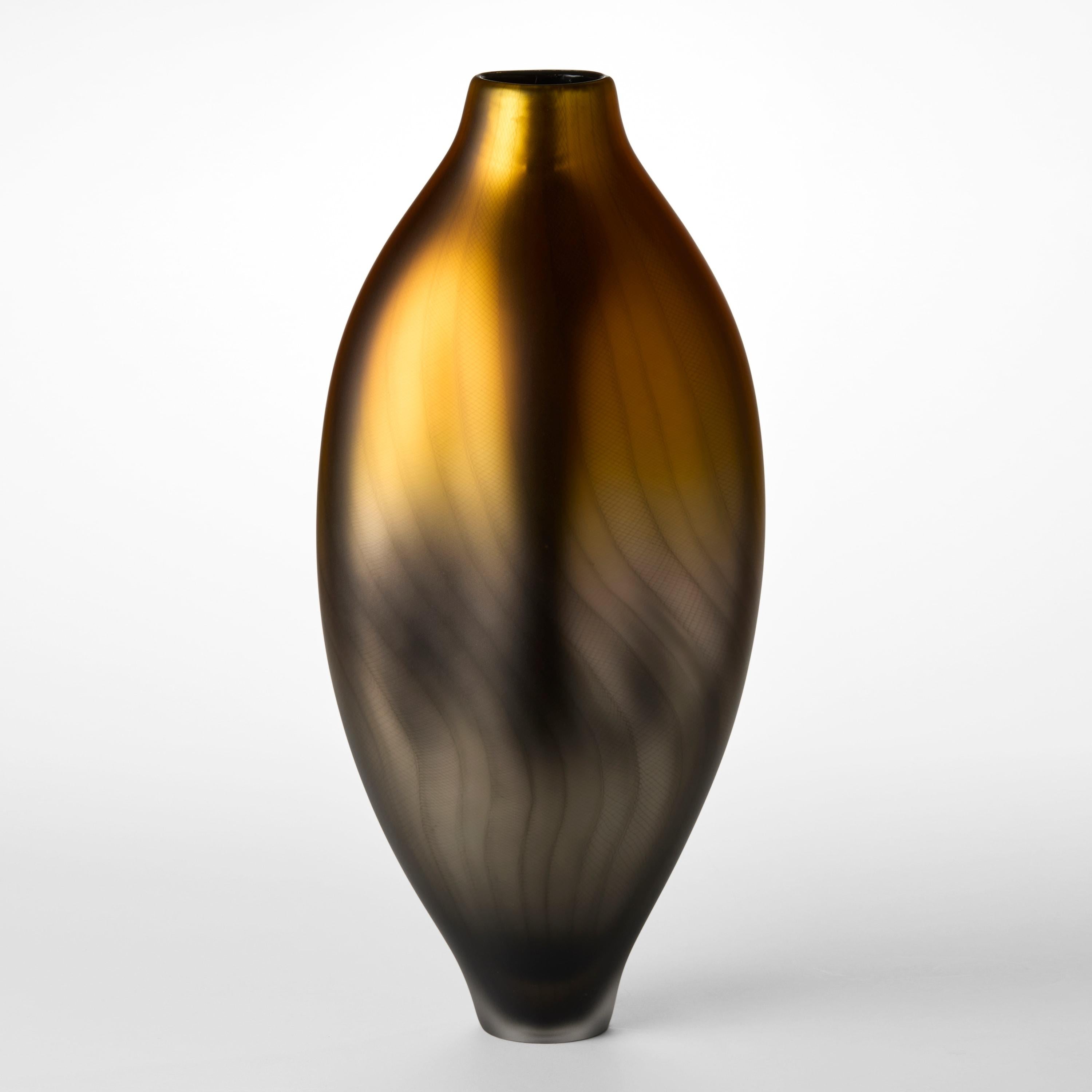 'Stratiform Aurum 2.0.004' is a unique glass vessel with fine filigree cane detail by the British artist, Liam Reeves. 

Liam Reeves has been making glass professionally since 1998 when he graduated from Middlesex University with a BA (Hons) in