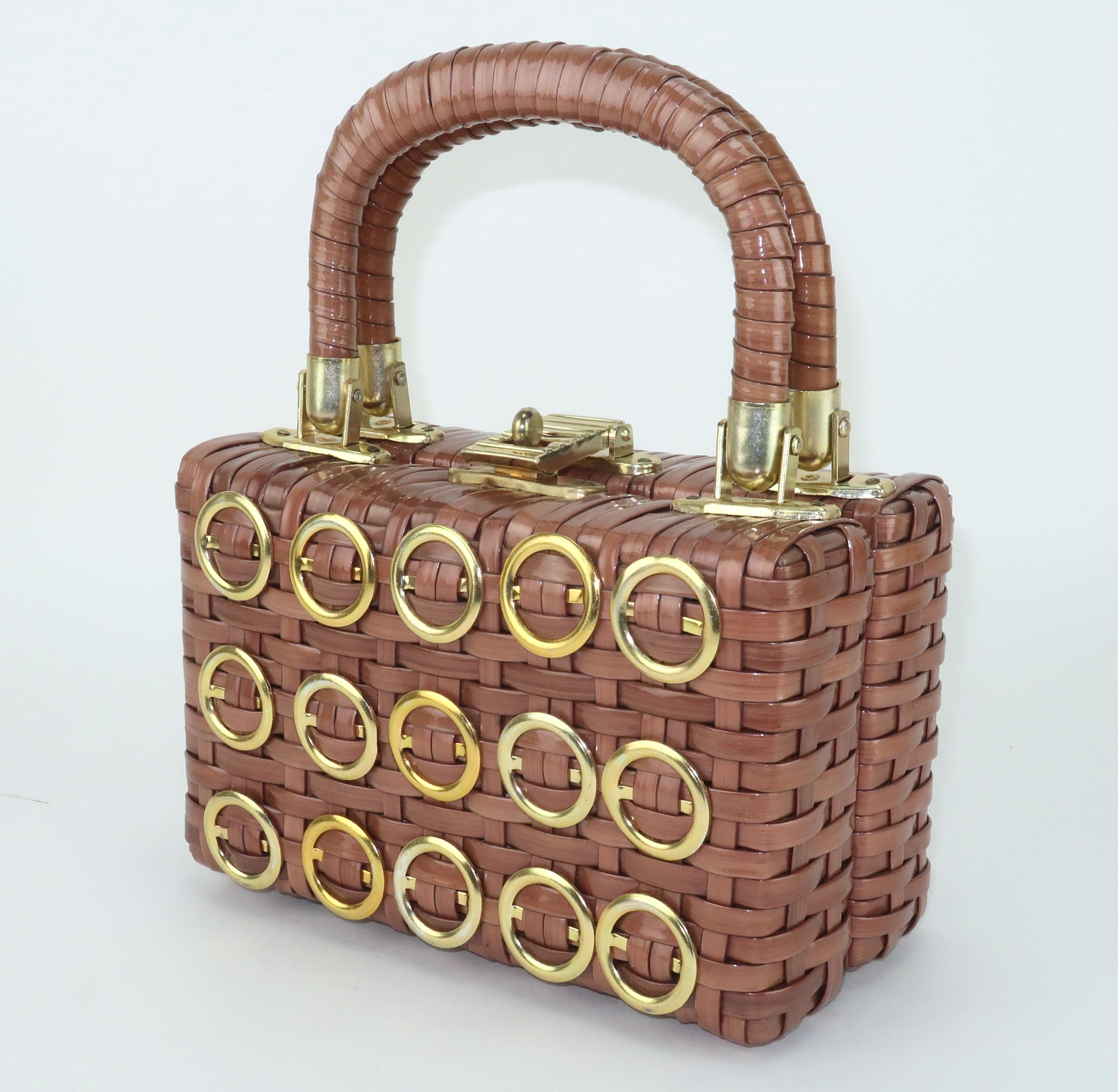 Mod 1960's coated straw wooden box handbag with top handles and gold tone metal ring accents.  The kisslock closure opens to reveal a vinyl lined interior with a zippered side pocket.  The base features nail head feet and leather hinges.  It is a