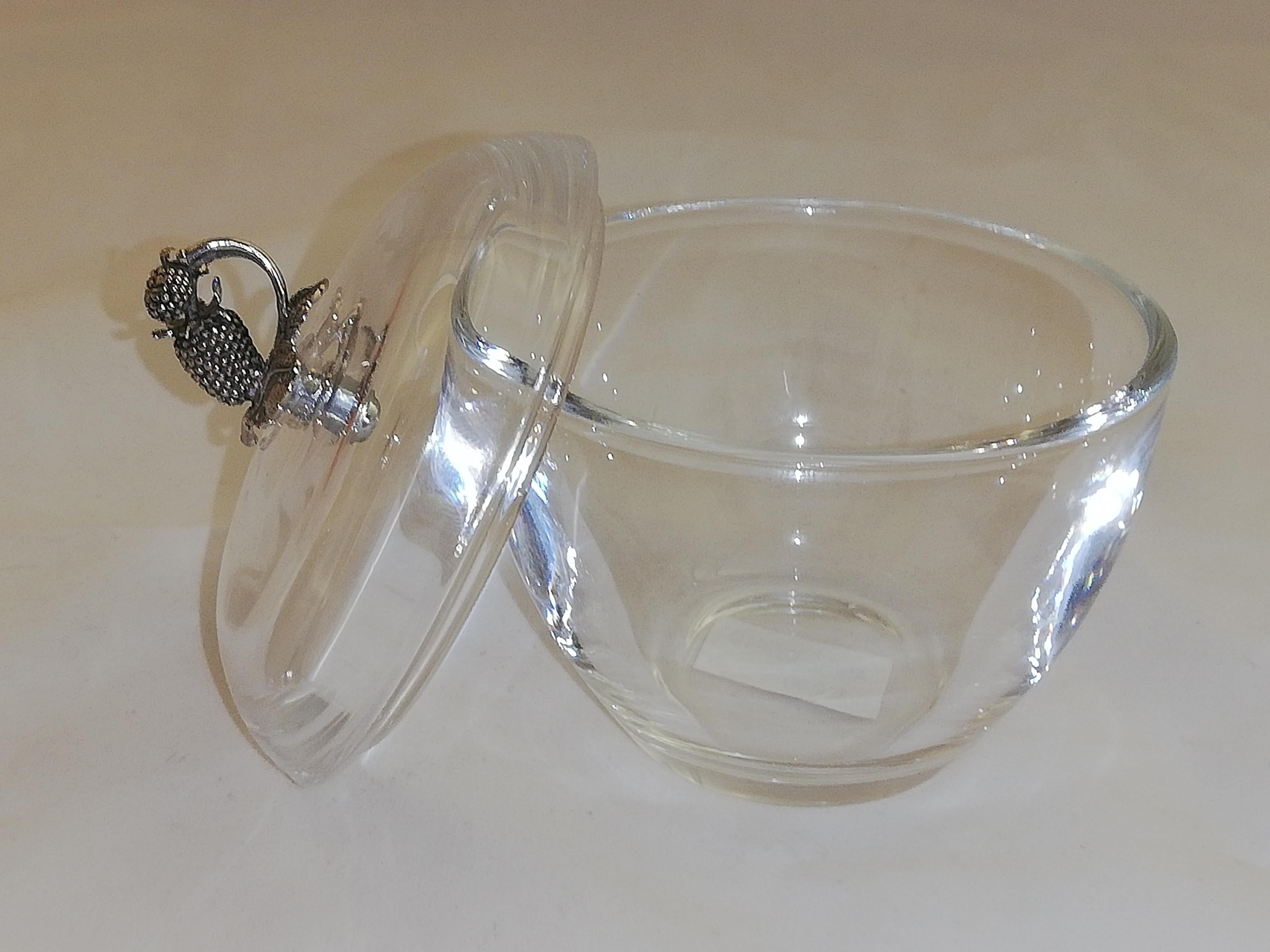 Crystal glass jam dish with a sterling silver strawberry on top.
Crystal is suitable for the dishwasher.
 