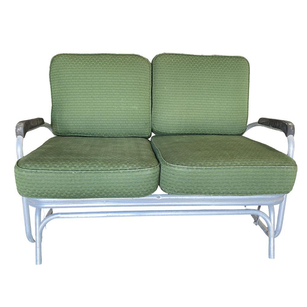 Art Deco patio lounge settee consisting of an aluminum tubular frame with decorative streamlined speed arms. The loveseat rests on a slider base with the ability to slide back and forth, like a gliding rocking chair.

Cushions made to order