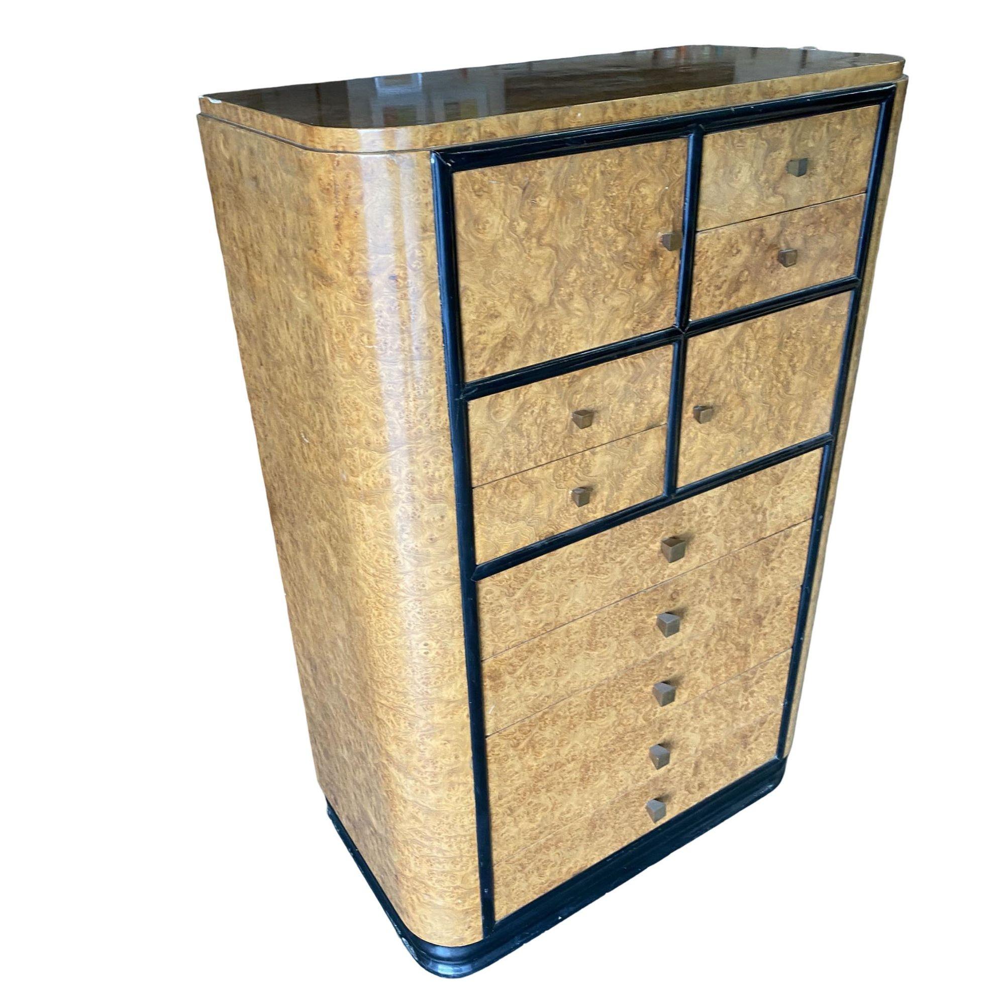 Original English European high-style Art Deco bronze and bird's-eye matching bedroom set featuring a lowboy dresser, highboy dresser, and vanity. Each piece comes with a stepped black lacquer base, black trim, and a bird's-eye maple body. Each