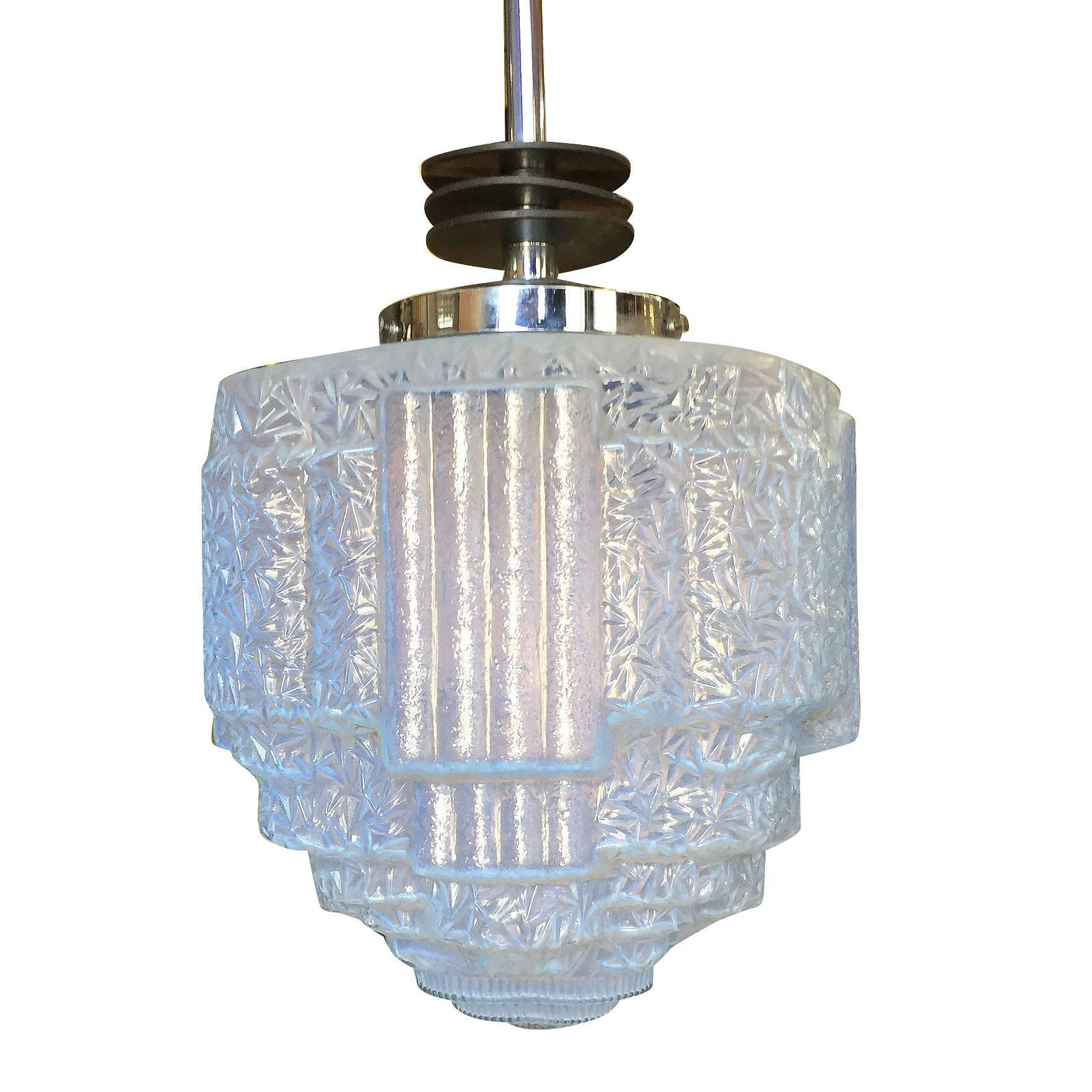 Rare Art Deco chrome ceiling pendant with enameled black streamline accents and texture blue glass Art Deco glass globe.
 