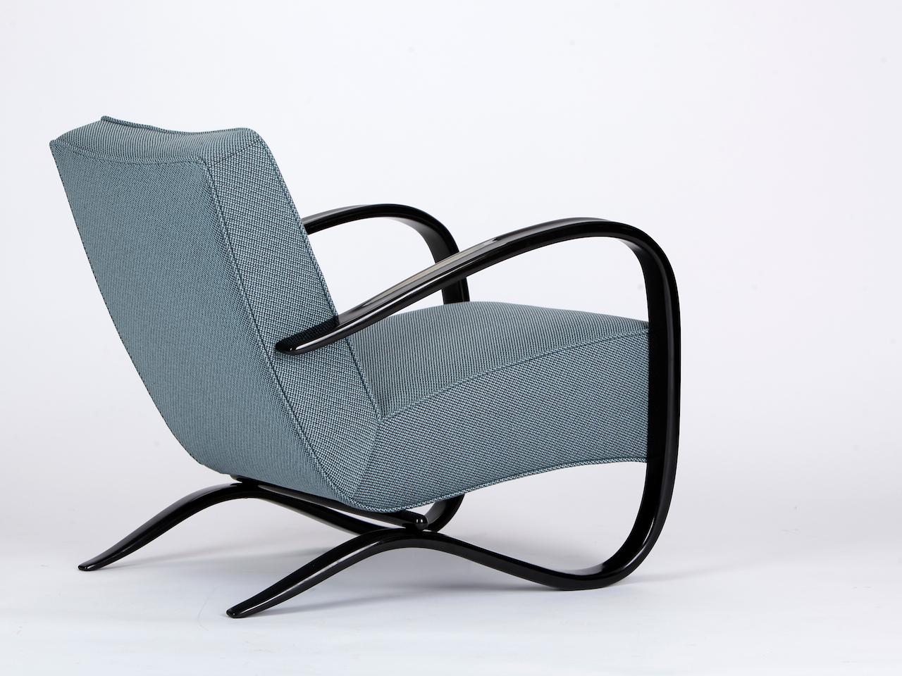 The lounge chair H-269 by Jindrich Halabala for Spojene UP Závody was produced during the 1930s. The armchair will be restored to order with a new spring core and upholstered with a dutch fabric by de Ploeg. Completely restored. The wooden parts are
