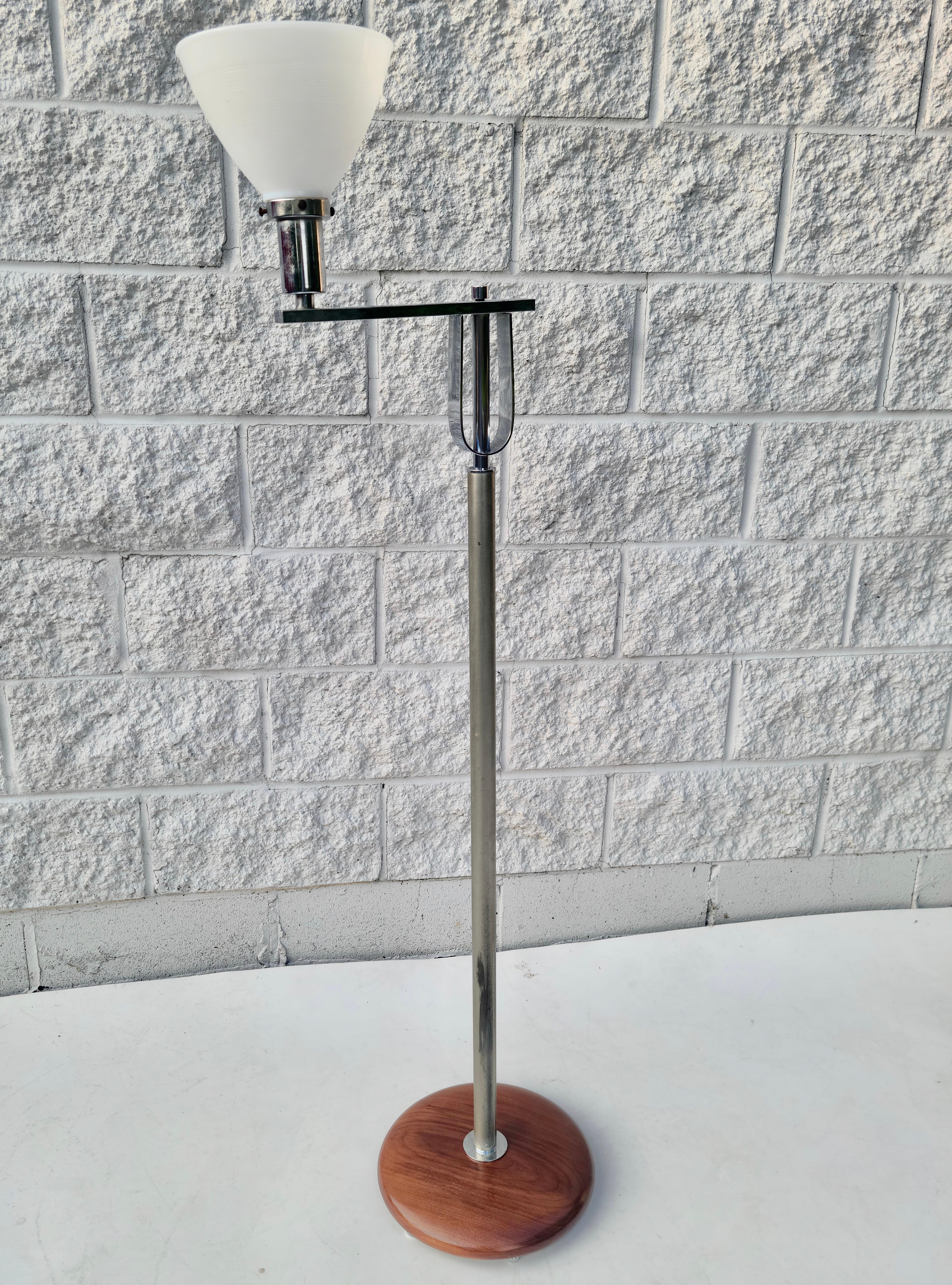 Please feel free to reach out for accurate shipping to your location.

Streamline bridge floor lamp.

Has milk glass diffuser.
No shade. 

Walnut disc base has been repaired and refinished.
Chrome and steel components have been cleaned for minimally