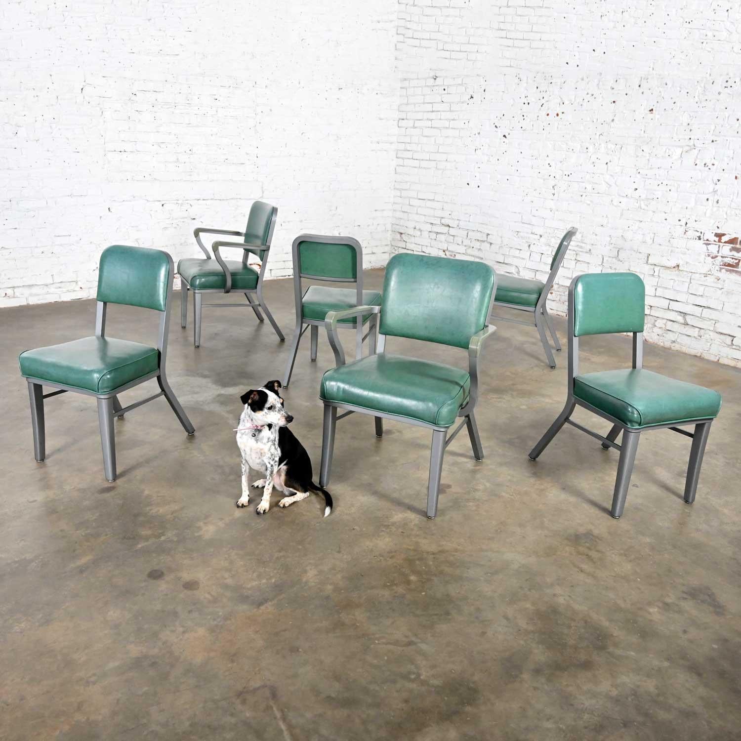 Handsome streamline industrial modern dining chairs 2 arm and 4 side by Steelcase Style 145 set of 6. Comprised of green vinyl faux leather and painted metal frames. Beautiful condition, keeping in mind that these are vintage and not new so will