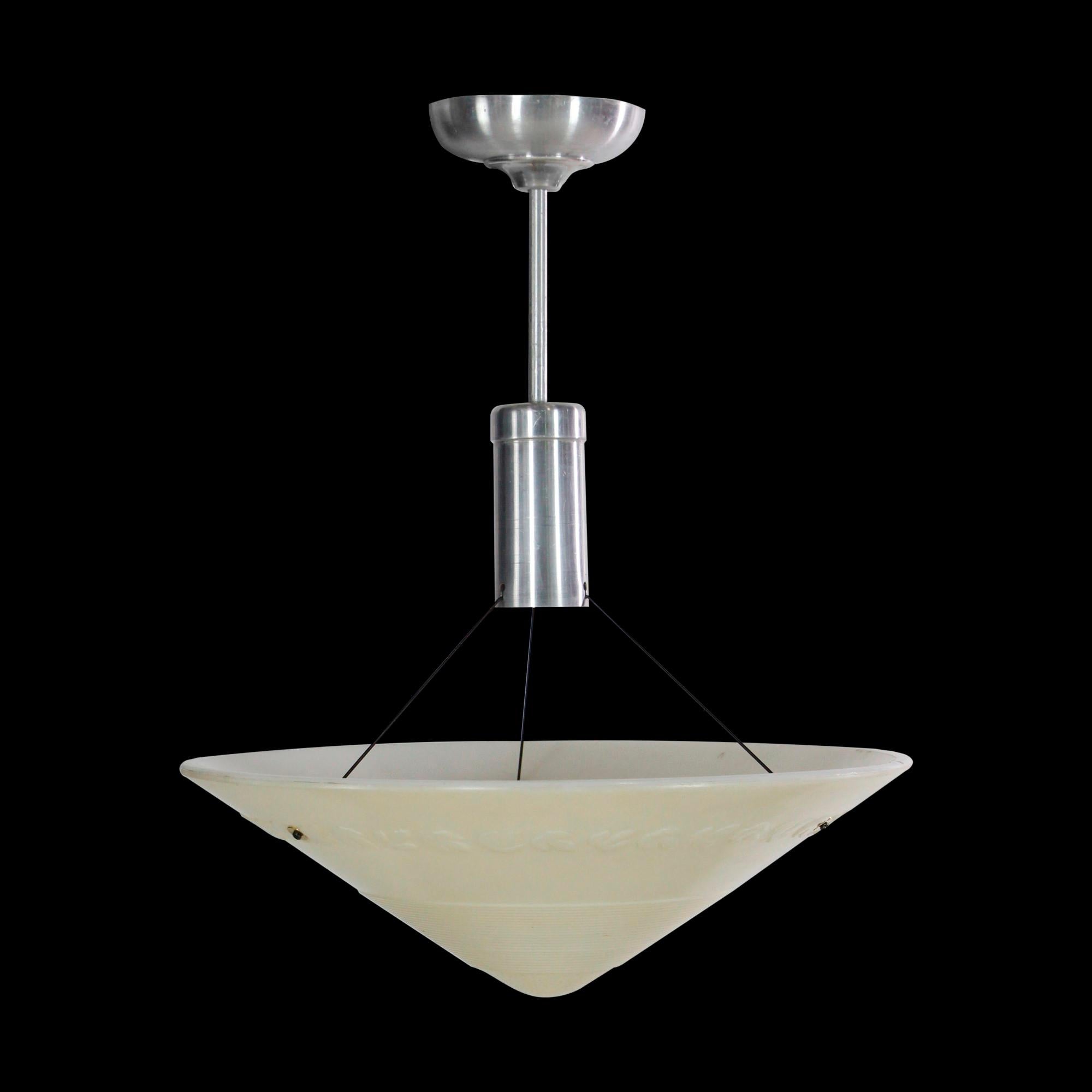 Streamline Moderne cone shaped milk glass pendant light suspended by an aluminum pole fitter. The 1950s shade gives indirect light and features line and leaf detail across the glass. Small quantity available at time of posting. Priced each. Please