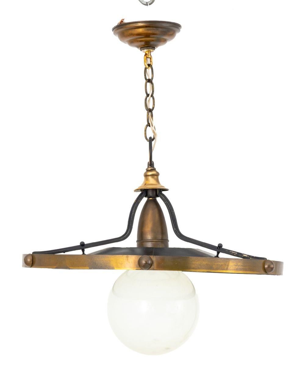 Streamline Moderne Style Pendant Lamp, brass and black tole peinte fixture and white glass globe shade. 26