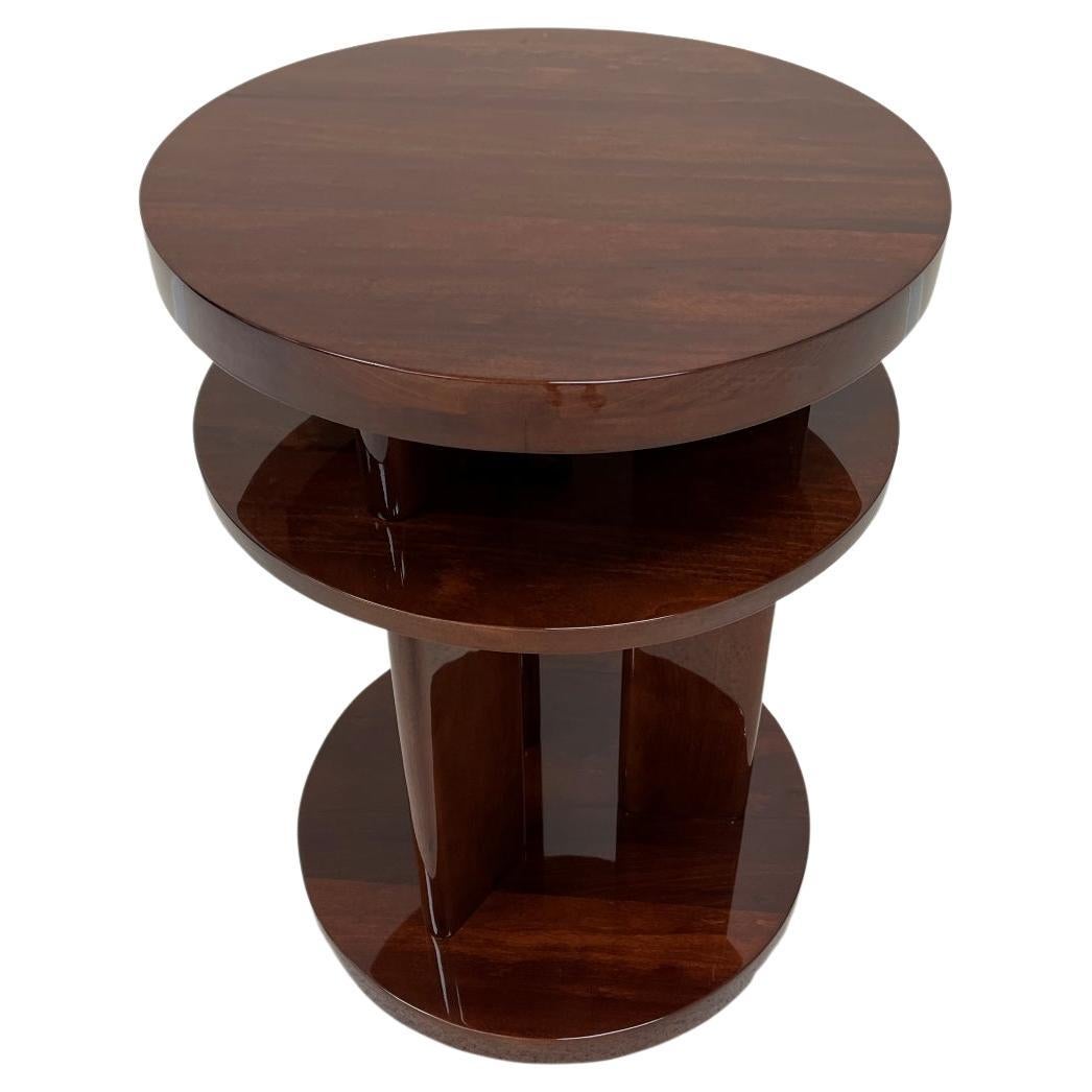 Elegant Art Deco side table reminiscent of the works by Donald Deskey or Gilbert Rohde. The table features three circular tiers connected by three streamline supports. A very versatile piece; perfect as an end, side or bedside table. Dimensions: 18