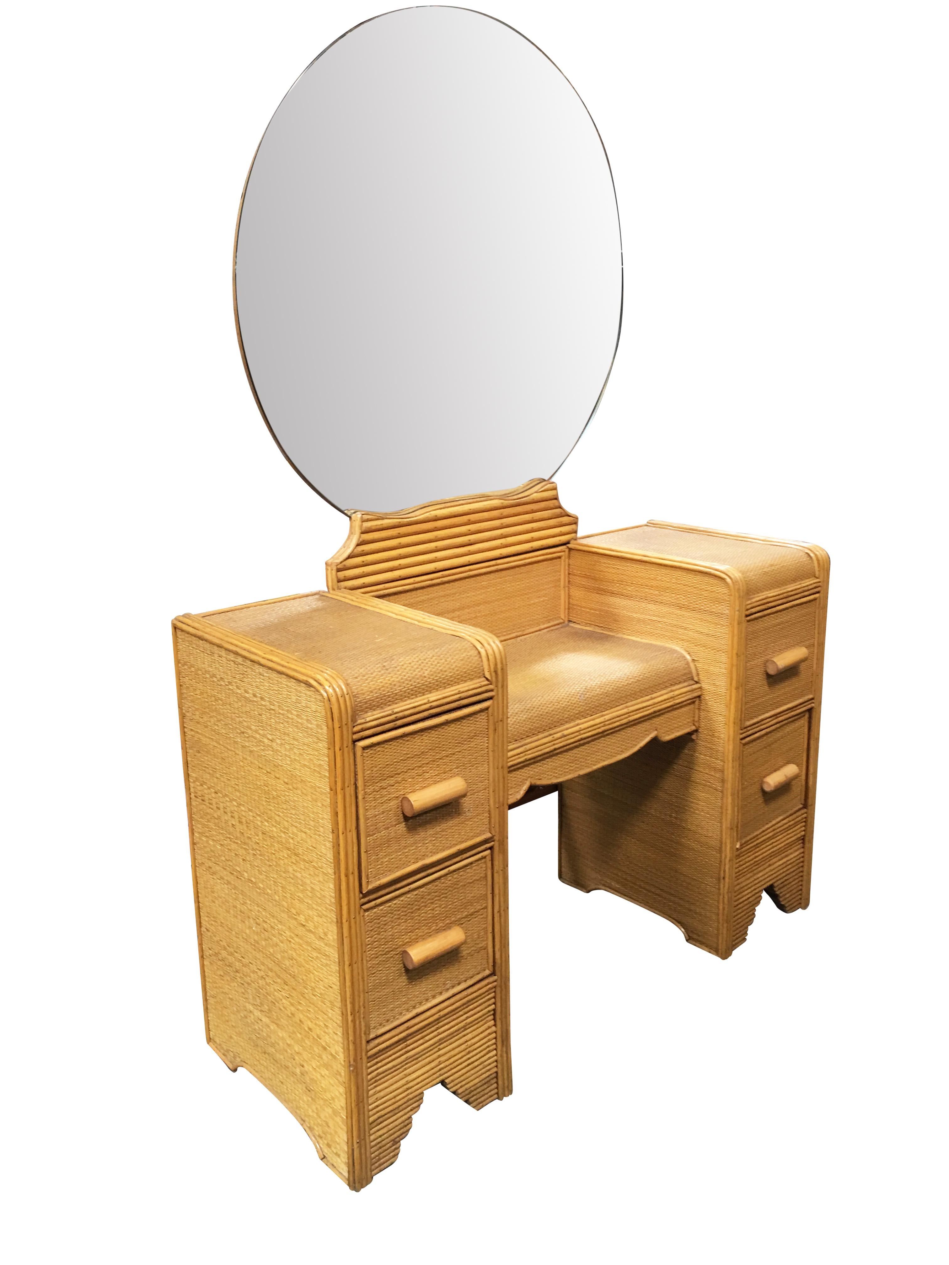 Stick rattan vanity with woven rice mat coverings and round rattan mirror. The vanity features decorative nail heads, larger vanity mirror and four side pull out drawers. 

Measurements: 55
