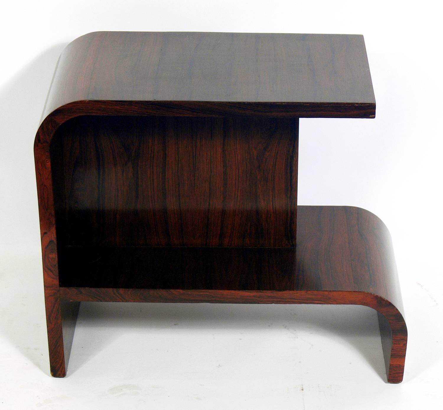 Streamlined Art Deco rosewood side wtable, probably American, circa 1930s. Retains original finish with warm original patina.