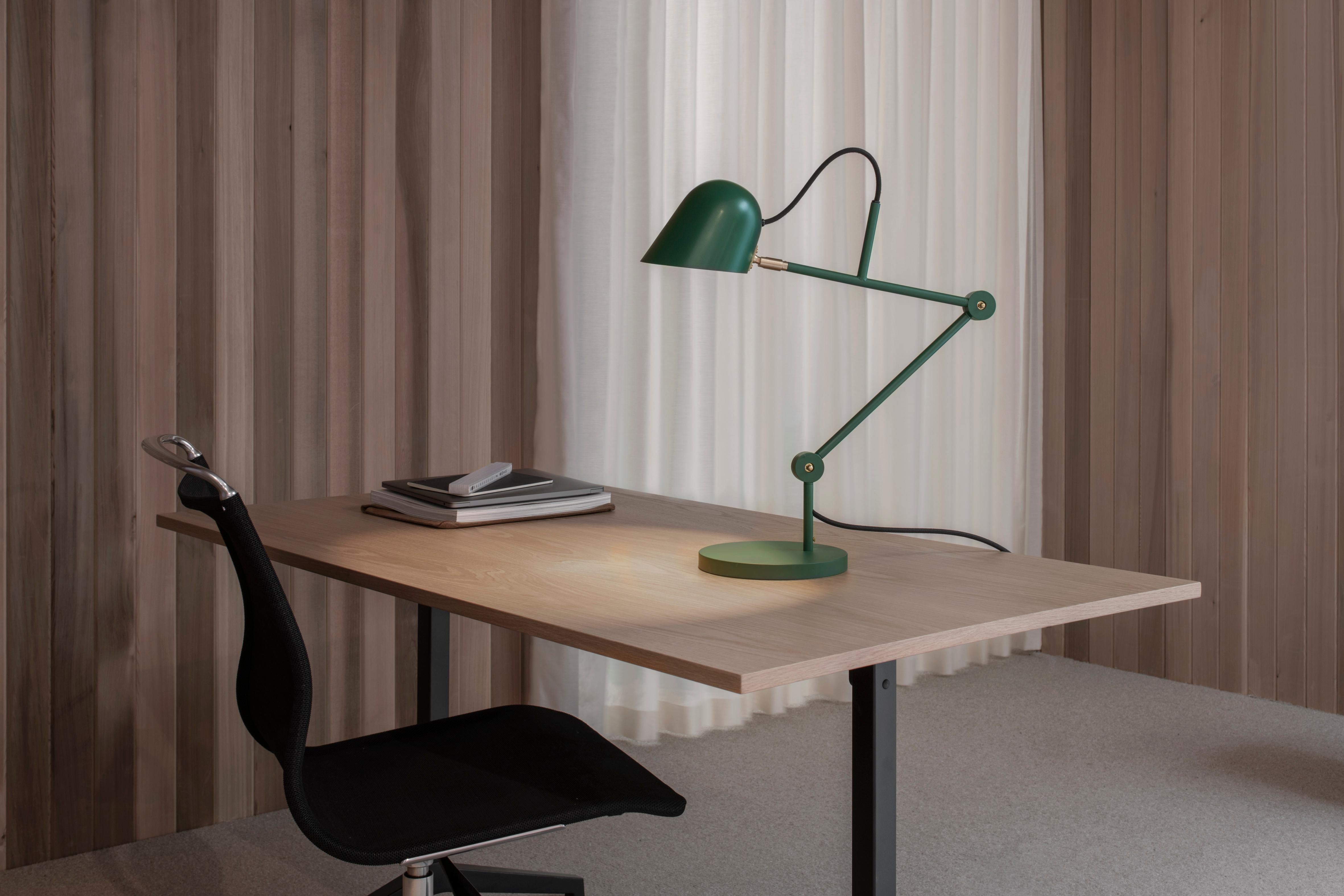 'Streck' adjustable table lamp by Joel Karlsson for Örsjö in pine green.

Executed in powder-coated steel with brass details, the 'Streck' series is both timeless and refined in its minimalism. Clean geometric lines and understated simplicity make