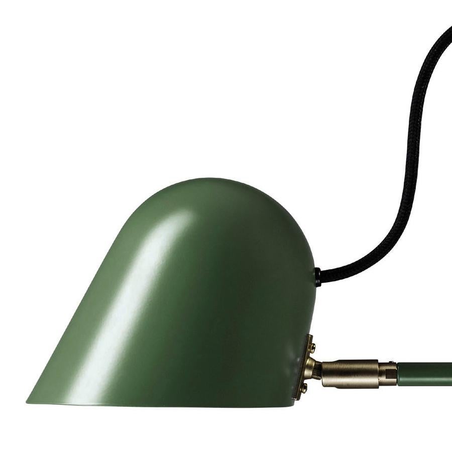 'Streck' table lamp by Joel Karlsson for Örsjö in pine green.

Executed in powder-coated steel with brass details, the 'Streck' series is both timeless and refined in its minimalism. Clean geometric lines and understated simplicity make each