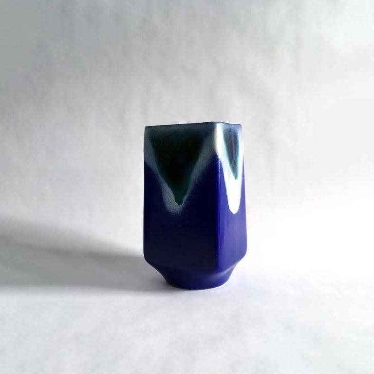 Blue vase by Strehla, with stunning glaze work in cobalt blue, white and teal. Beautiful rounded square silhouette. 

Measurements: H 7