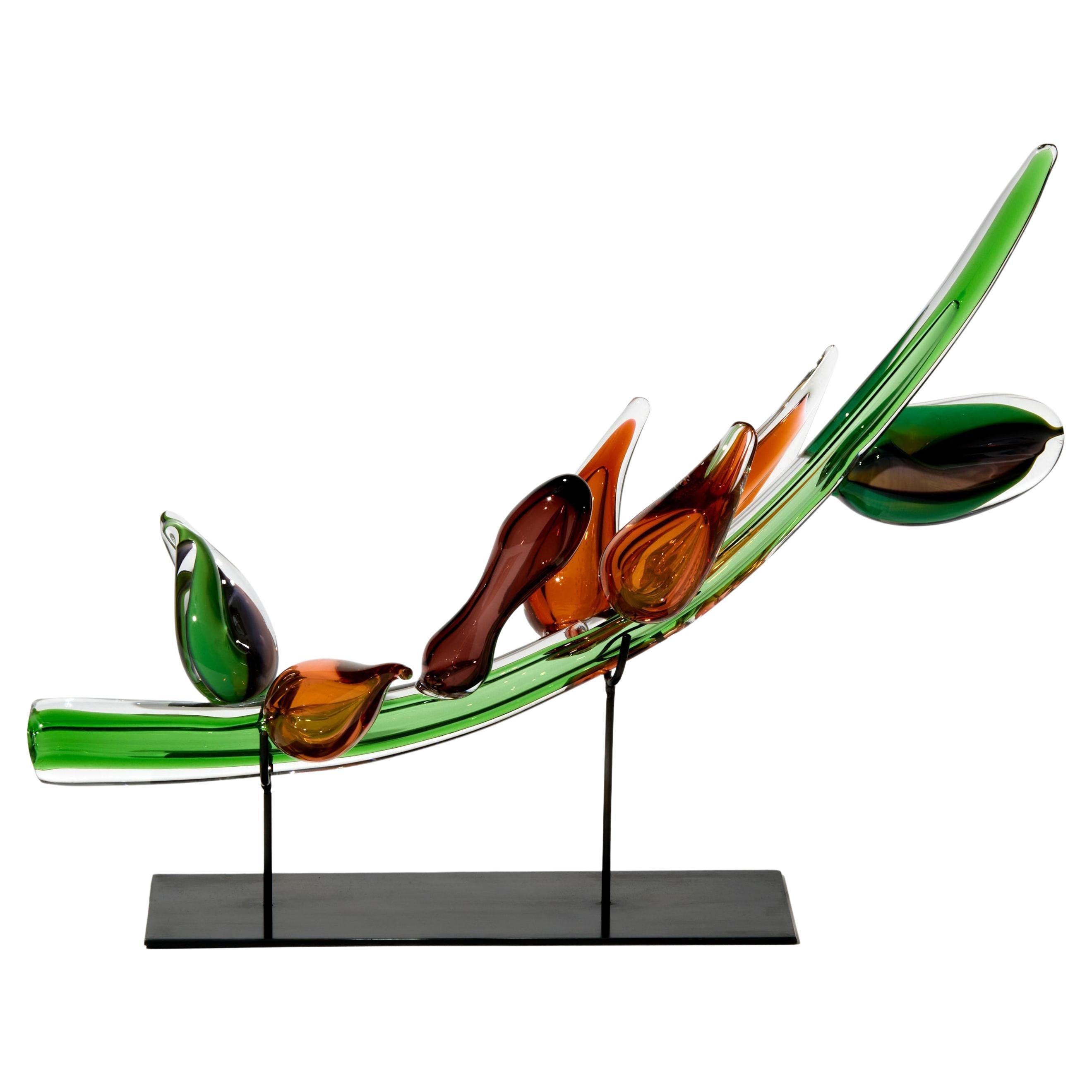 Strelitzio II, a green 
amber botanical glass artwork by Michèle Oberdieck