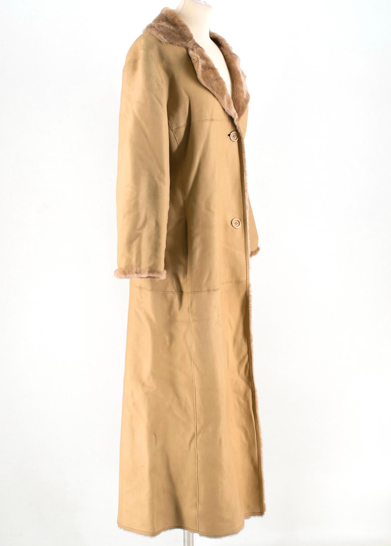 Strenesse Camel Leather Fur Coat

- brown leather coat 
- lamb shelling inside
- button fastening 
- slip pockets 

Please note, these items are pre-owned and may show some signs of storage, even when unworn and unused. This is reflected within the