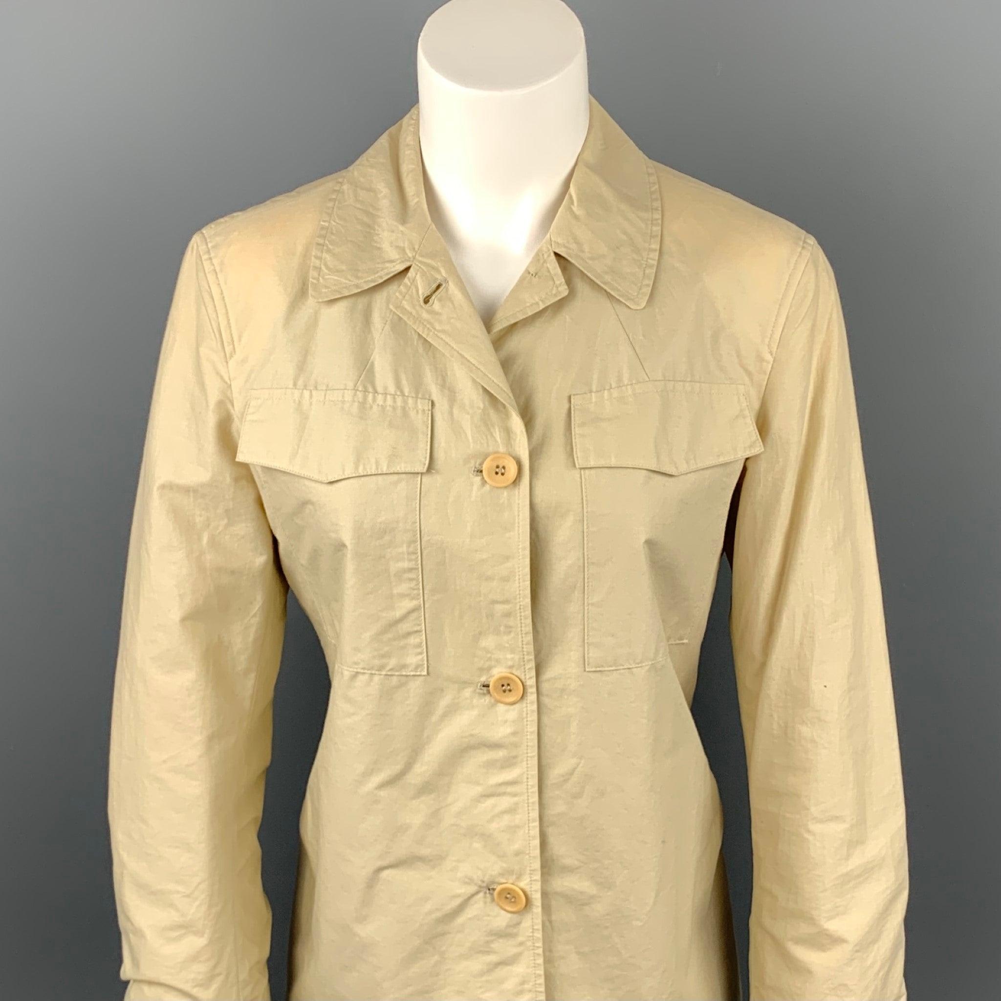 STRENESSE jacket comes in a beige cotton featuring a spread collar, patch pockets, and a buttoned closure. Discoloration throughout. As-Is.
Fair
Pre-Owned Condition. 

Marked:   US 6 

Measurements: 
 
Shoulder: 16 inches 
Bust: 36 inches 
Sleeve: