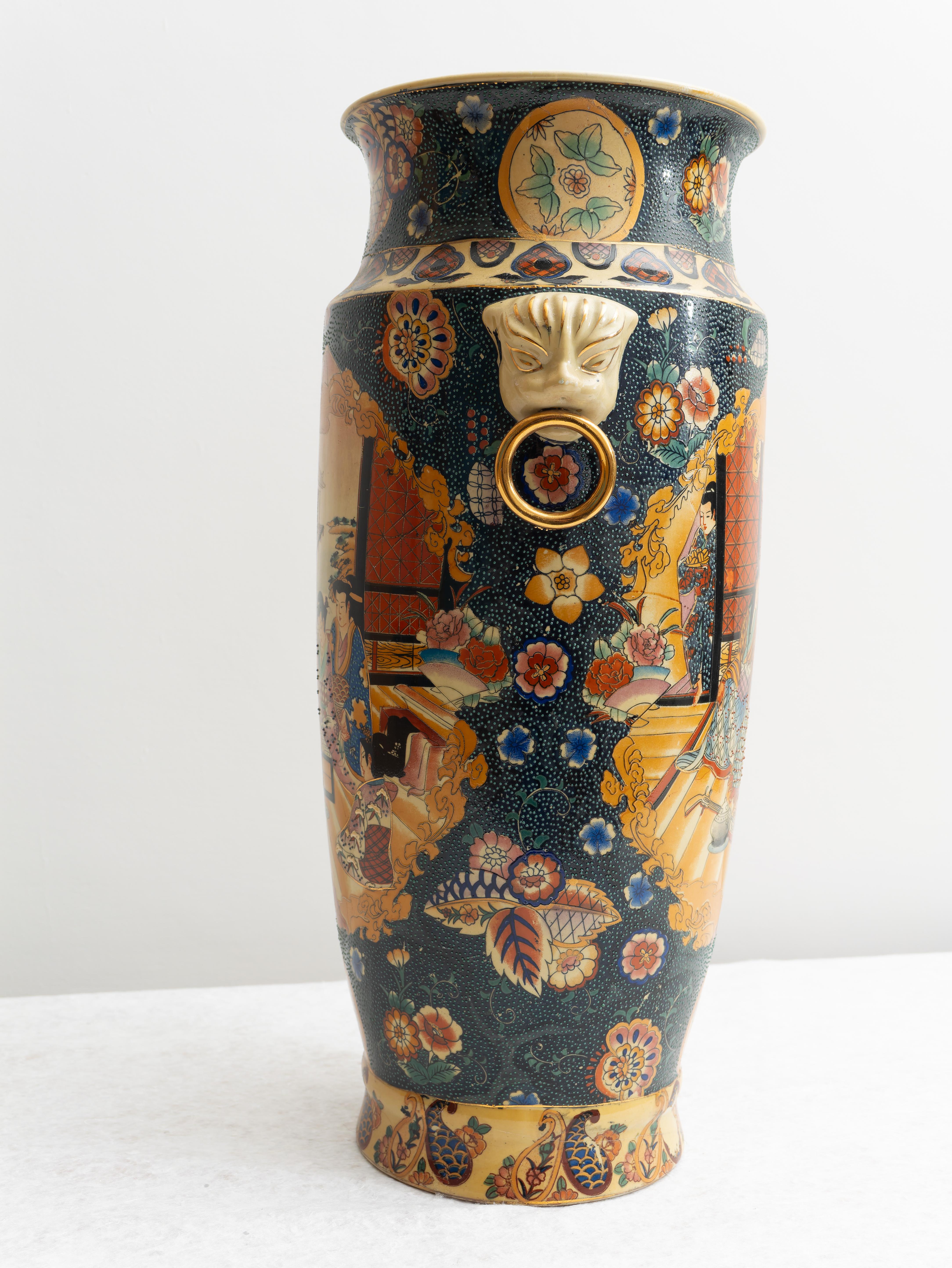 Stunning Japanese porcelain vase, 20th century. 
Beautiful hand-painted Japanese Vase embellished with rich decorations and scenes of life. The decorations are meticulous and finished in gold. H cm 50. Good state of preservation. May show very