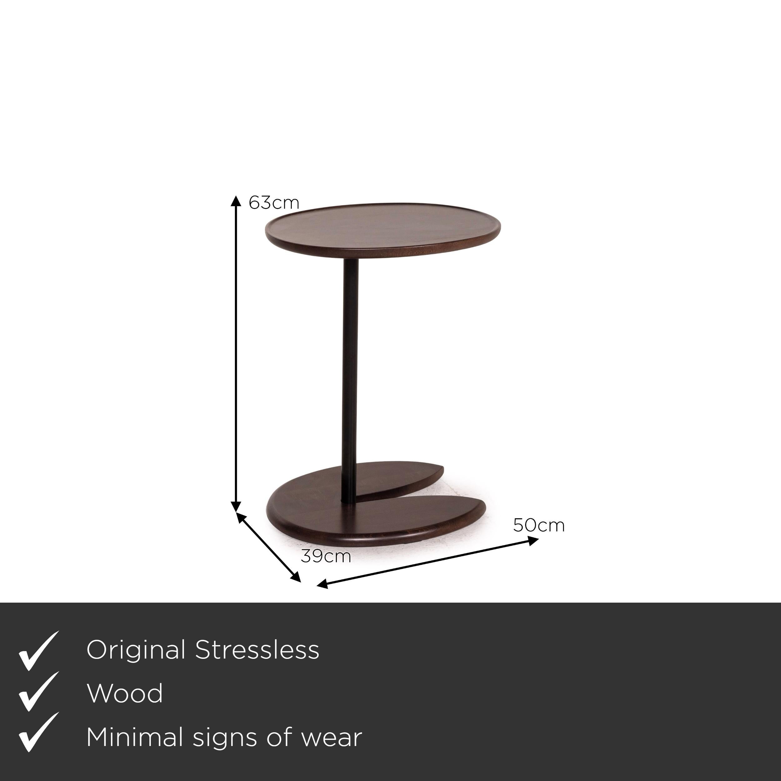 We present to you a stressless wood side table dark brown table.
  
 

 Product measurements in centimeters:
 

 Depth 39
Width 50
Height 63.




  
