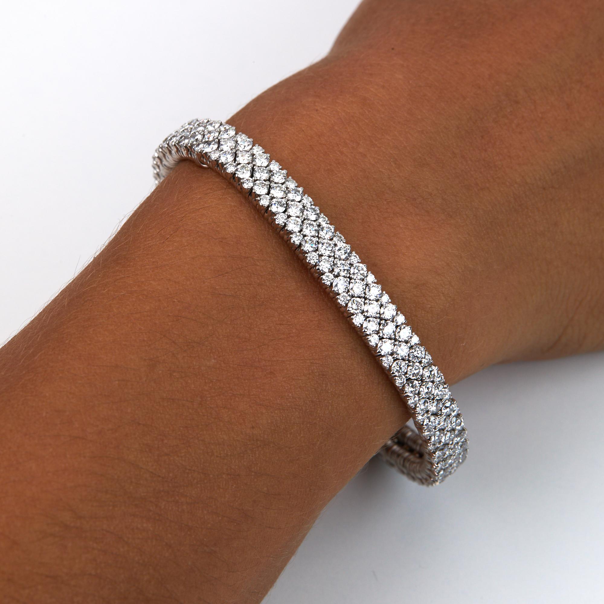 Stretch Diamond Bangle Bracelet with 8.88 carats of brilliant round cut diamonds, all F-G color and VS clarity.  This amazing and fashionable modern bracelet is hand made in Italy using trademarked technology.  We use medical grade stainless steel