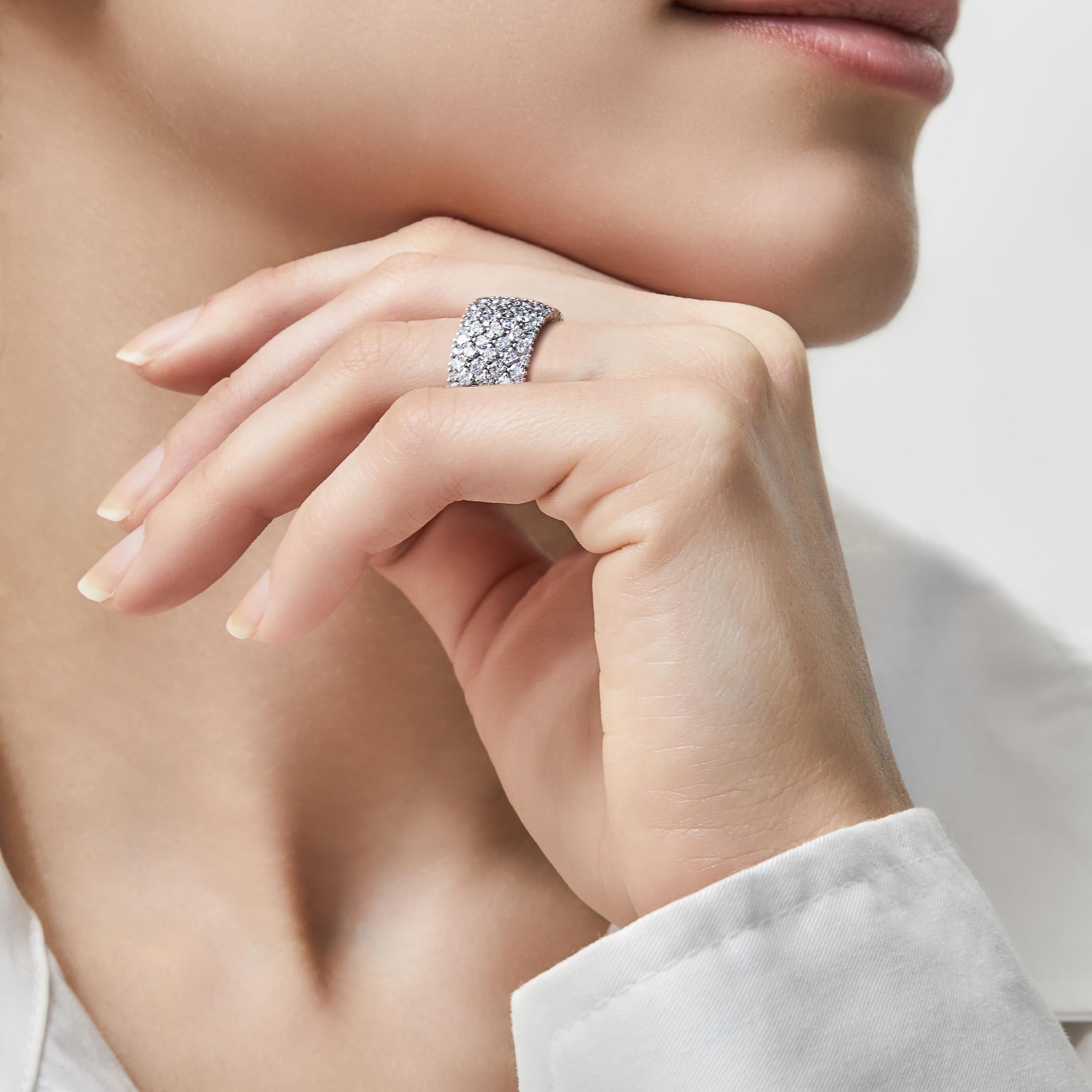 A flexible diamond façade gives the appearance of the stones being interwoven in the Stretchy Diamond Tapestry Ring. The flexible 18-karat white gold construction offers unparalleled comfort in this style that easily stretches to slide over the