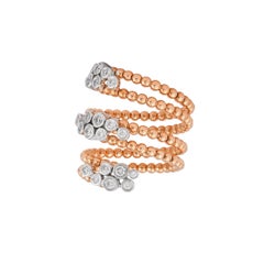 Sunita Nahata Anillo elástico de perlas de oro y diamantes en oro blanco y rosa de 18 quilates.