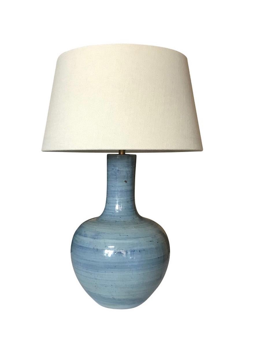 Contemporary pair of blue terracotta thin neck lamps with horizontal brush design.
New Belgian linen shade.
Measures: Overall height including shade 29