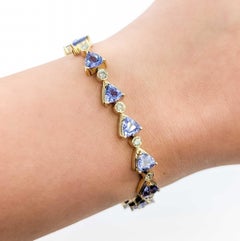 Llamativa pulsera de eslabones de oro amarillo de 14k con tanzanita y diamantes
