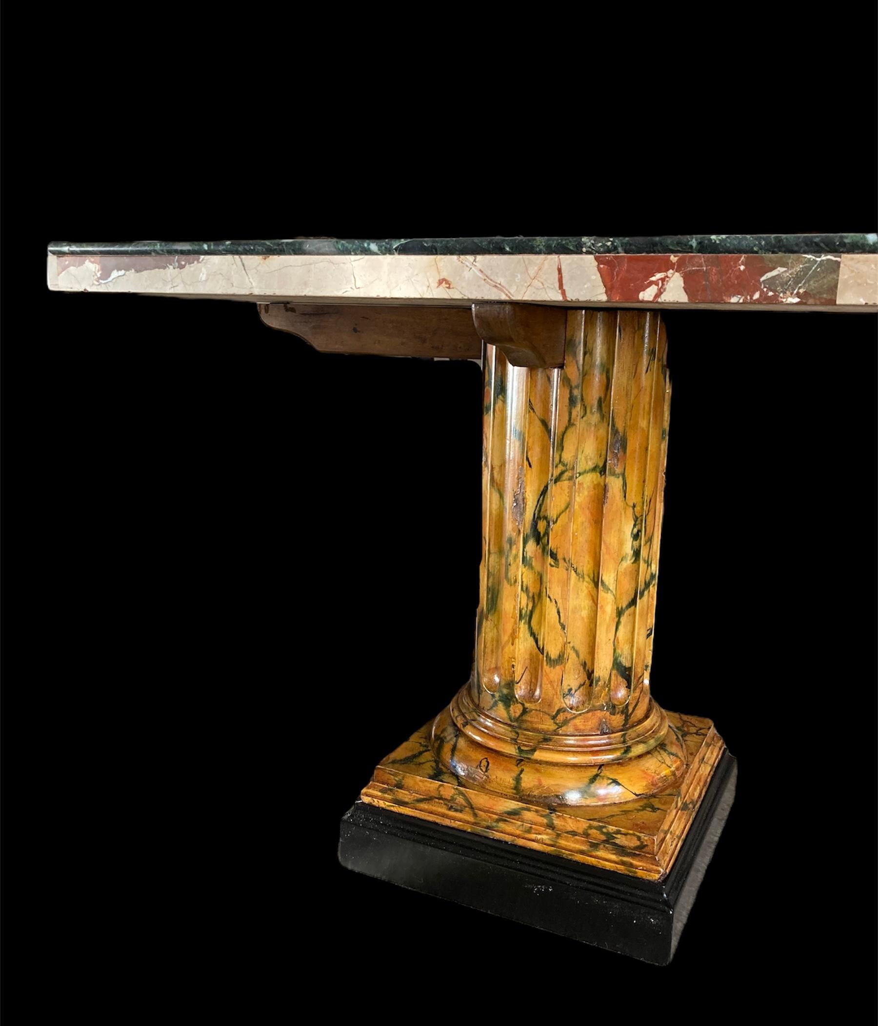 Striking 19th C marble top coffee table with later wooden fluted column base.