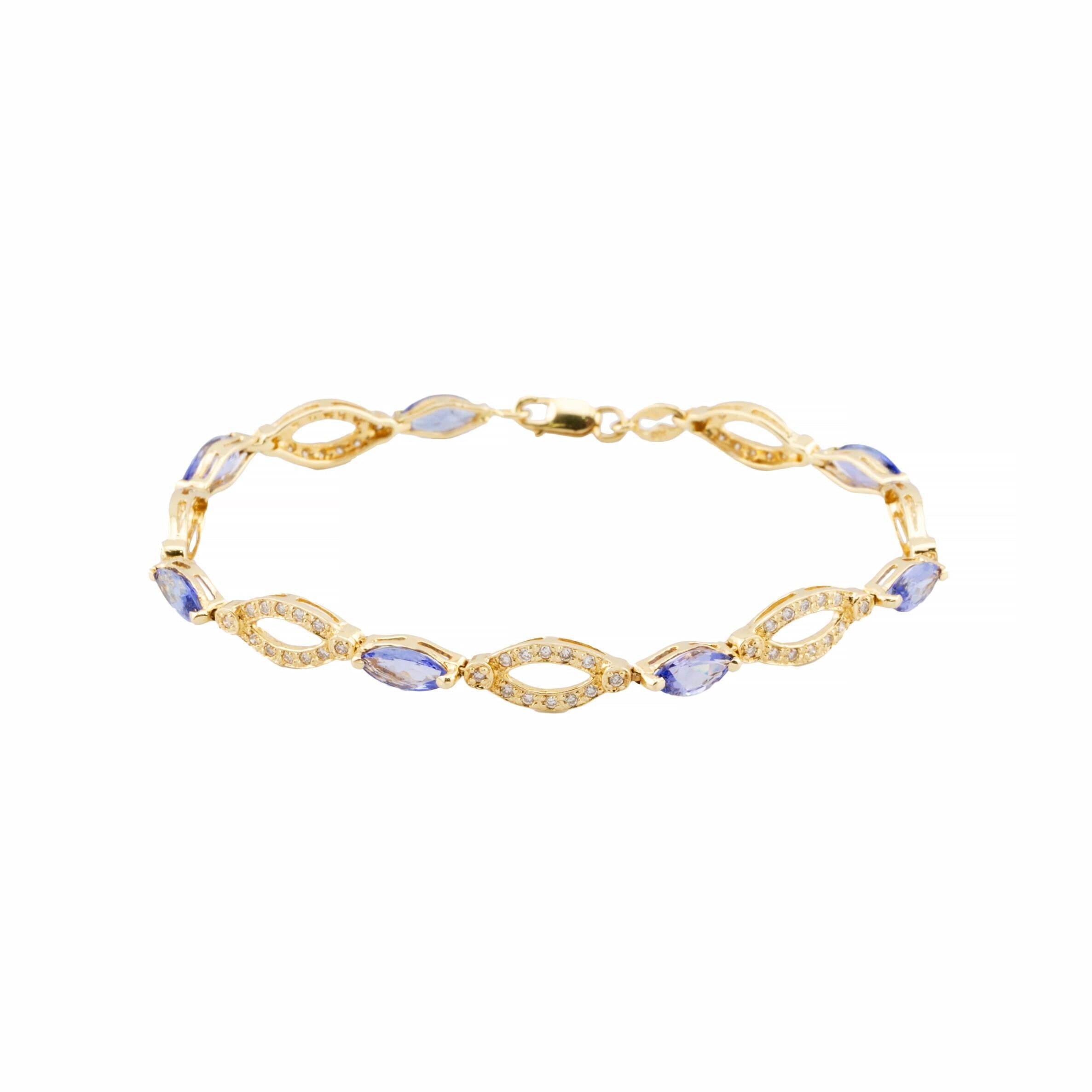 Aston Estate Jewelry presents:

A striking tanzanite and diamond bracelet in 14K yellow gold. The seven vivid purple tanzanite gemstones are 2.10ct total weight. Accenting the bracelet are pave set diamonds totaling 0.84ct. Around each diamond is