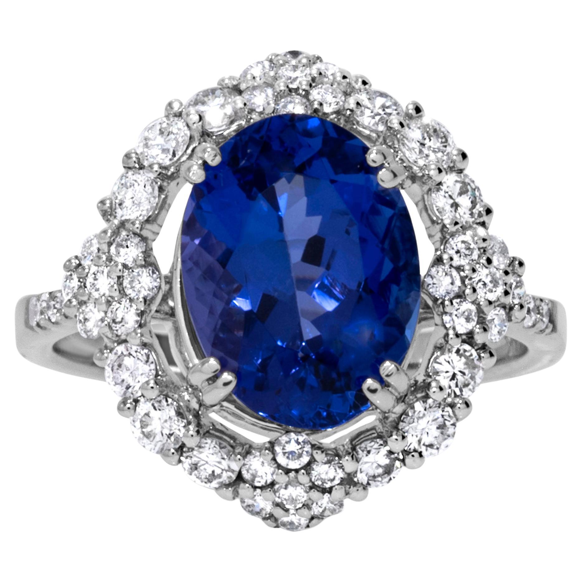 Striking 7.69 Carat Blue Oval Tanzanite & Diamond Ring in 14k Yellow Gold