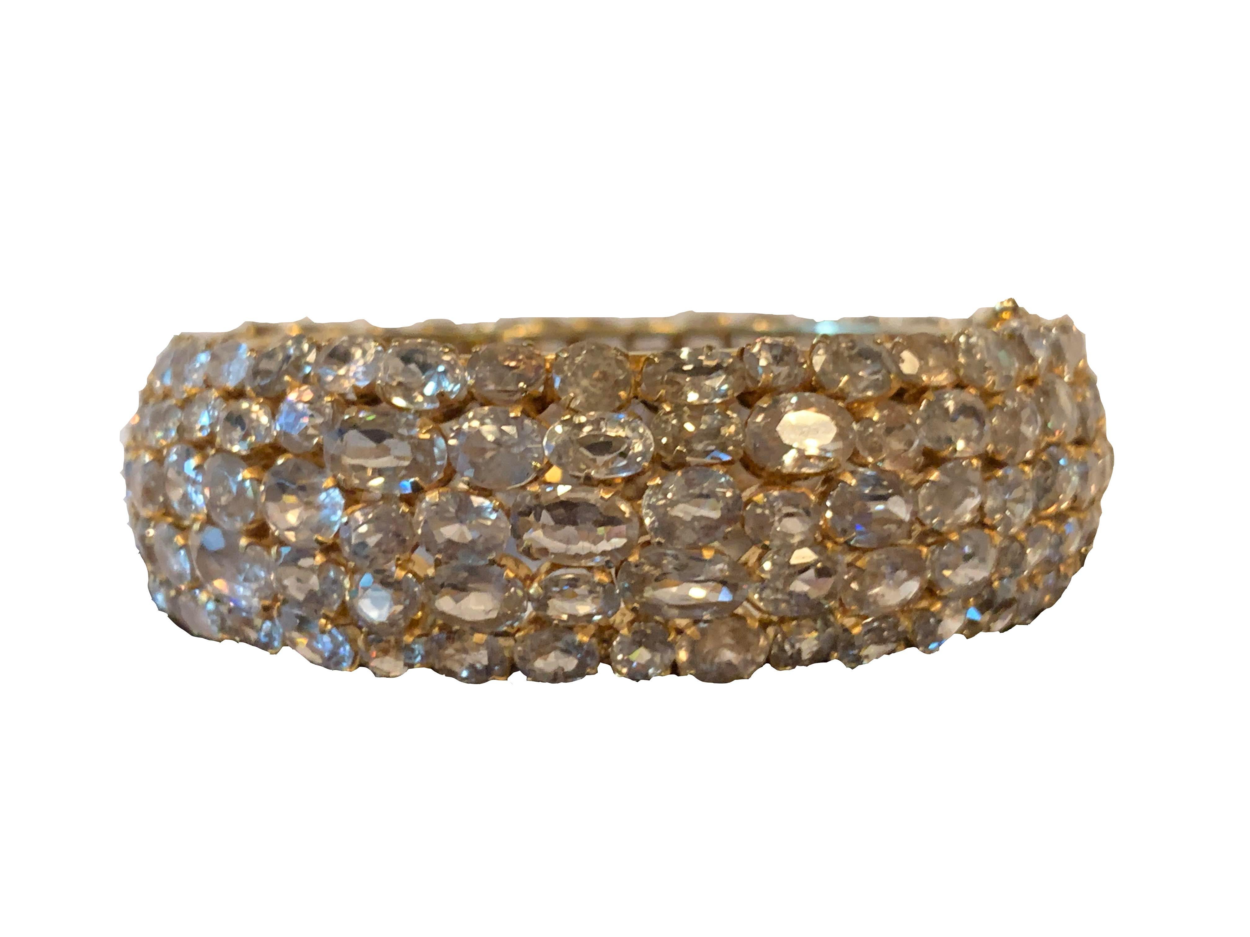 Striking All-around Multishape Genuine Golden Rutilated Quartz Vermeil Bangle Bracelet. The stones are individually set on 18k Gold plated Sterling Silver. Push clasp closure with double '8' safety locks. Marked: 925. Fits average wrist size.