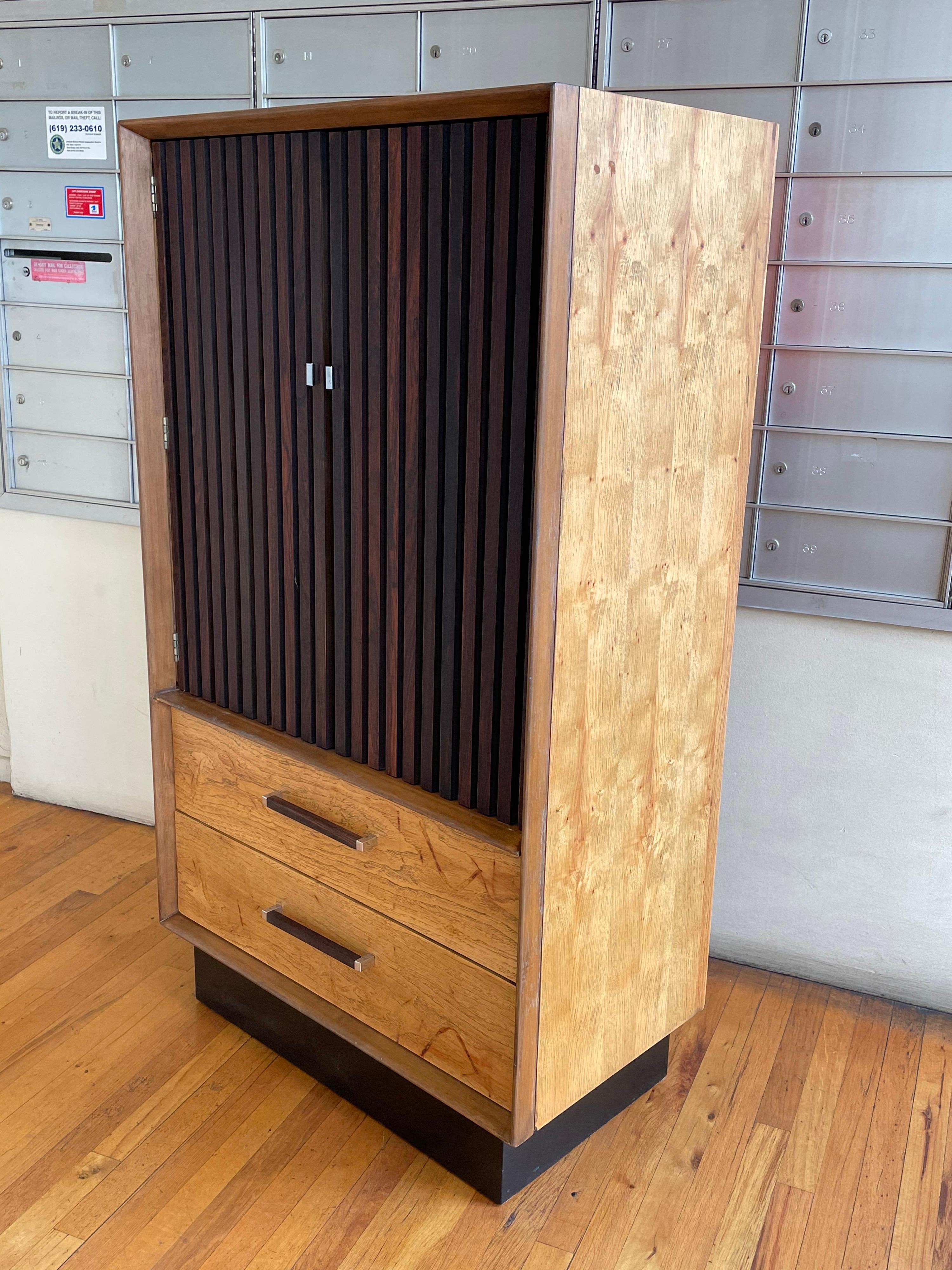 Beautifully freshly restored tallboy dresser, in light walnut, finish with rosewood door panels professionally refinished we replace the back panel with orange acrylic looks great, we lacquer the drawers in white, and resprayed the base in a black