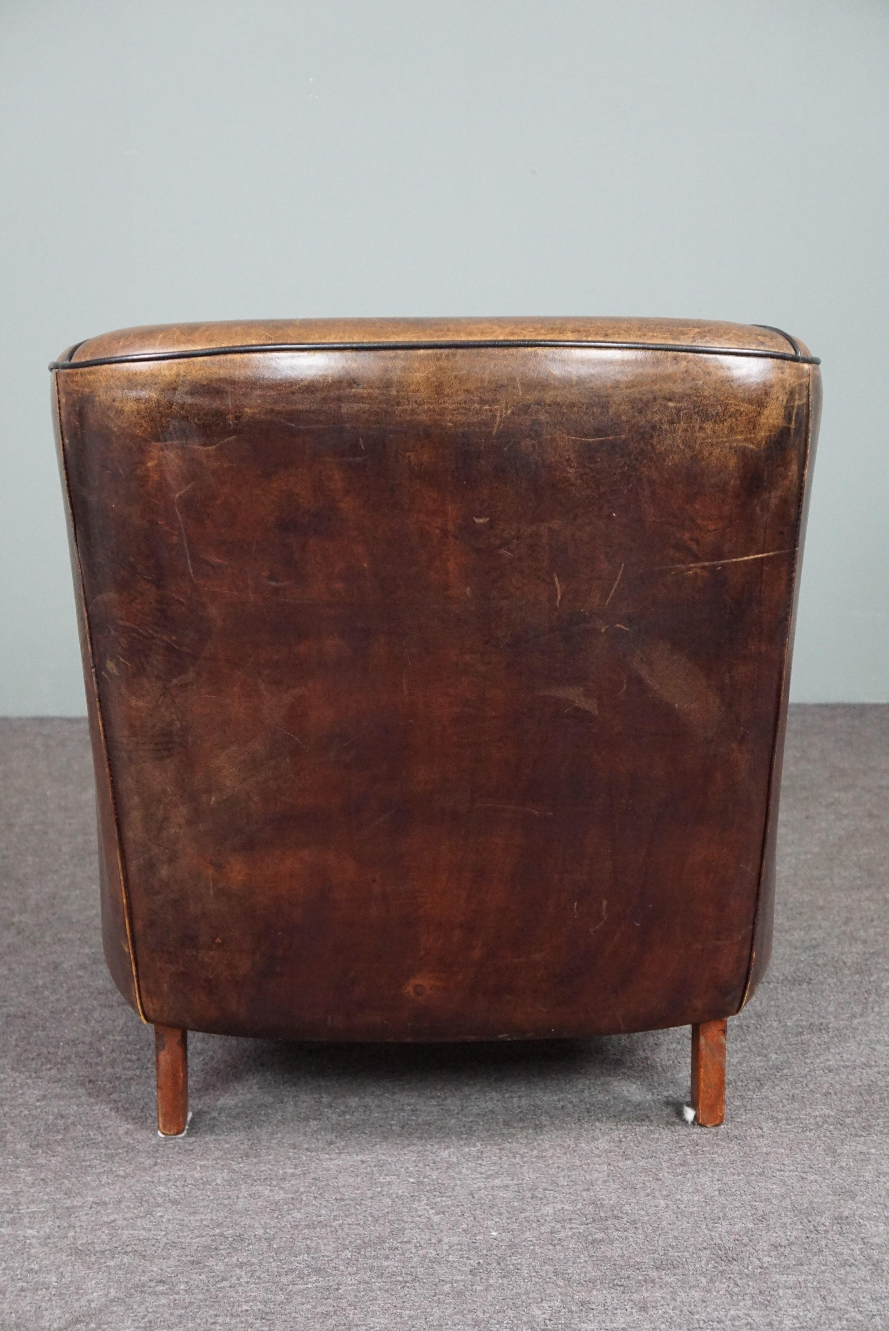 Hand-Crafted Striking and sleekly designed sheep leather club armchair For Sale