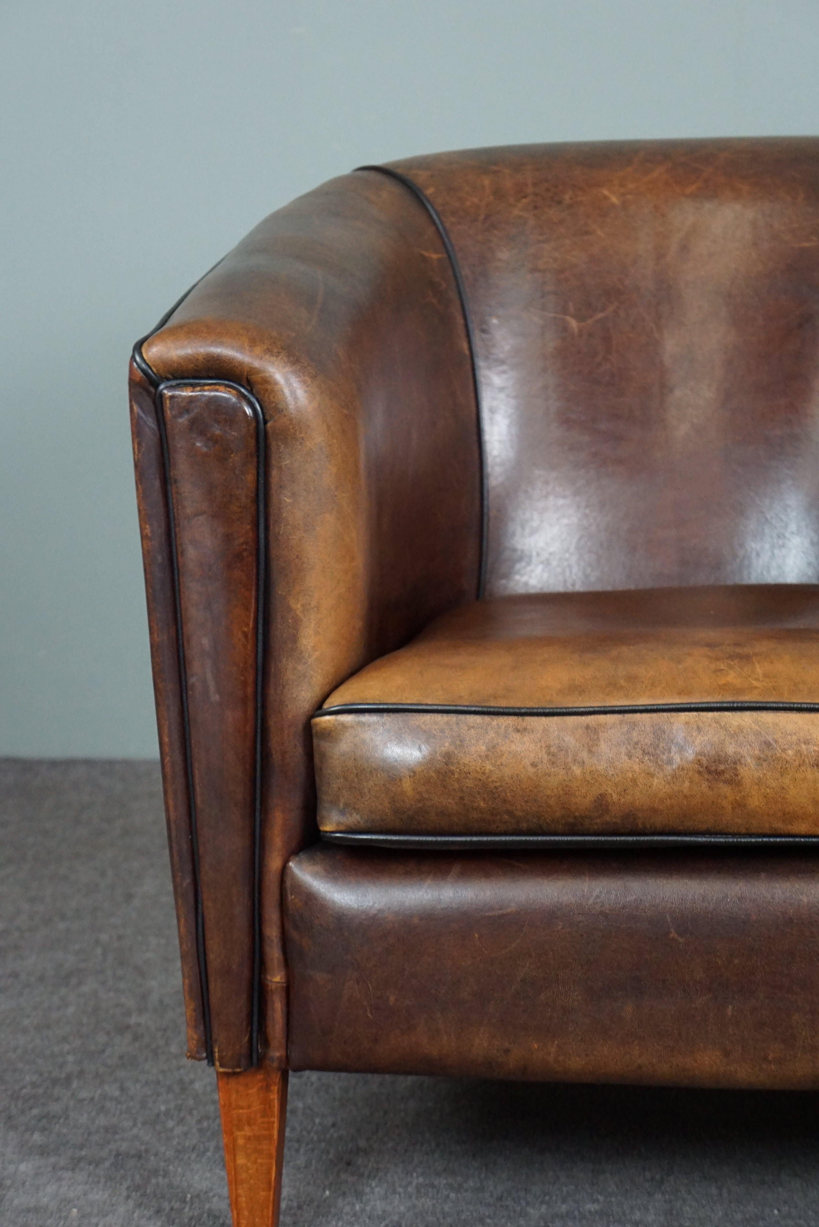 Leather Striking and sleekly designed sheep leather club armchair For Sale
