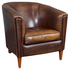 Striking and sleekly designed sheep leather club armchair