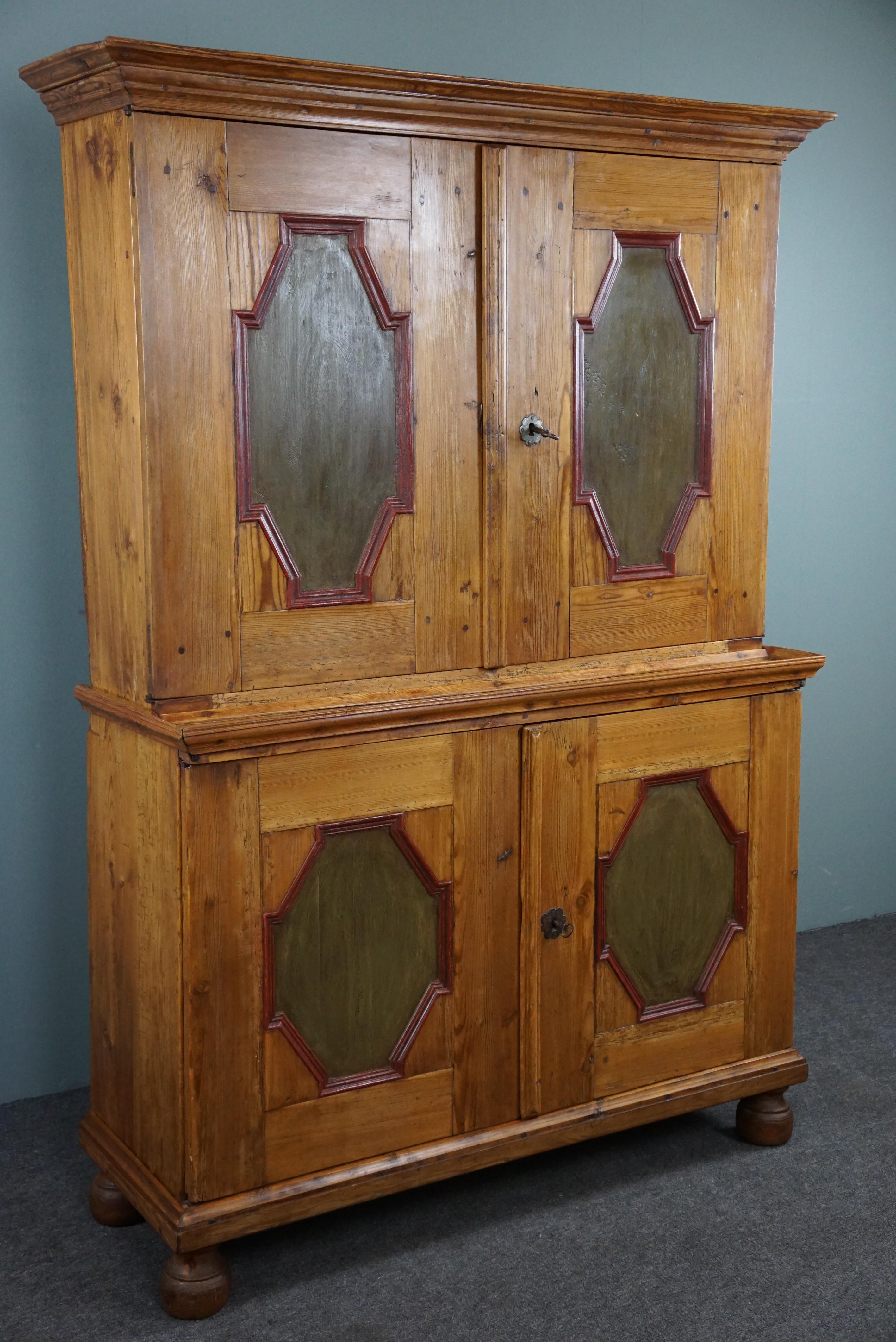 Offered is this antique folk art buffet cabinet with a practical layout and shelves. Explore our splendid pine buffet cabinet (made in 1840-1860) with painted doors, practical shelves, and layout that will add a touch of rustic charm and
