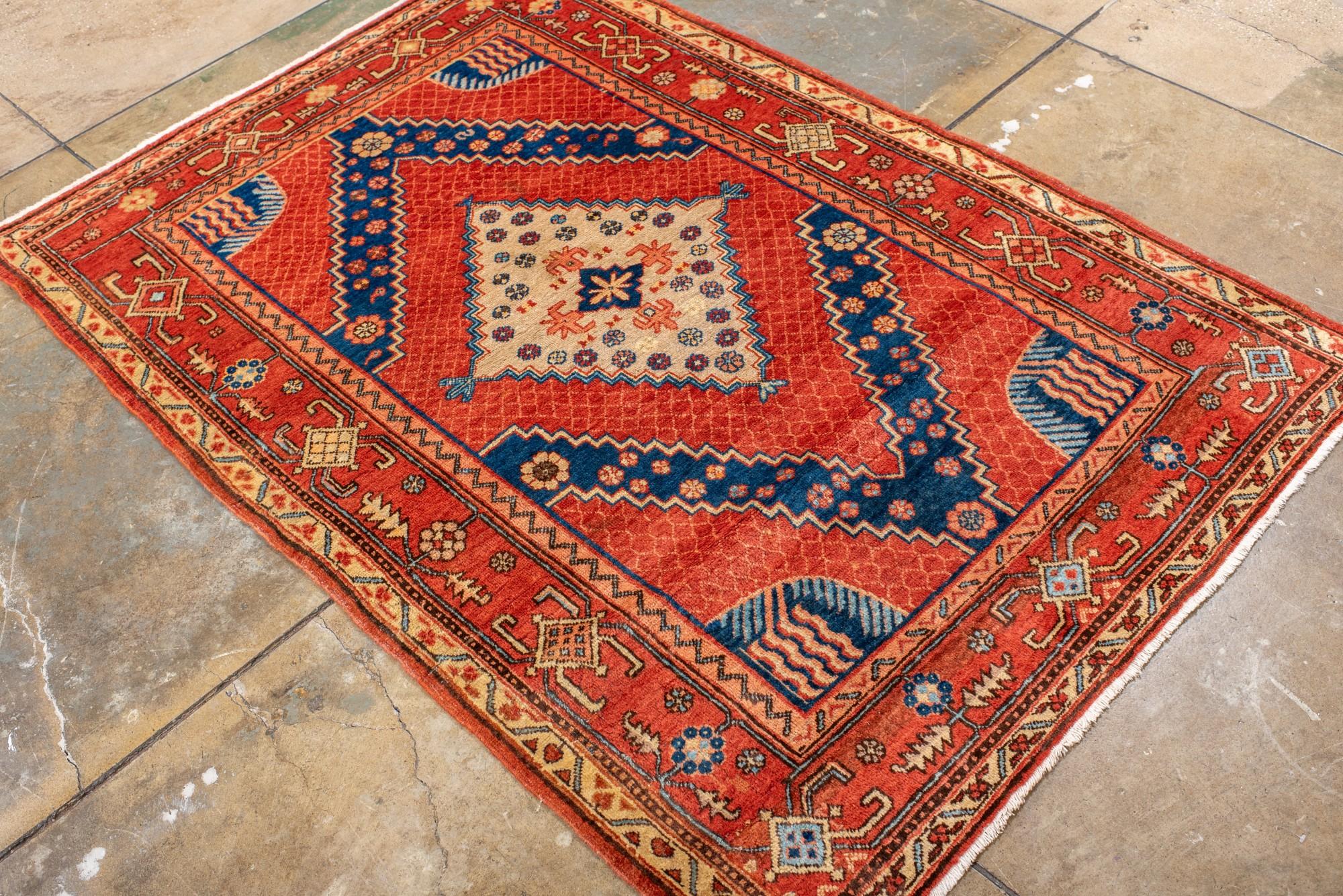Wool Striking Antique Khotan Rug with a Center Medallion For Sale