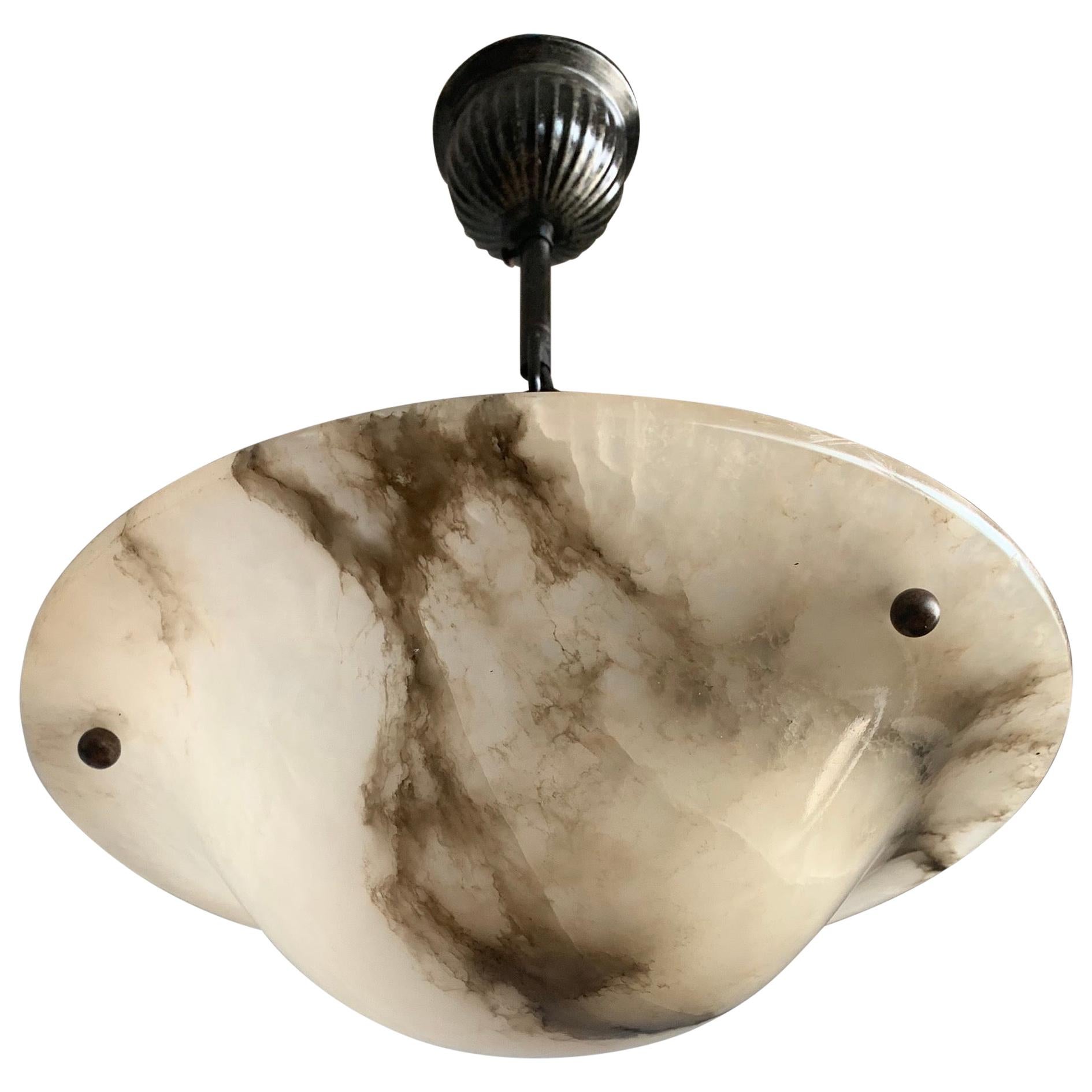 Yet another marvelous light fixture for an entry hall, bedroom or any other small room.

With early 20th century light fixtures being one of our specialties, we always love finding timeless pendants and flush mounts that are in very good condition.