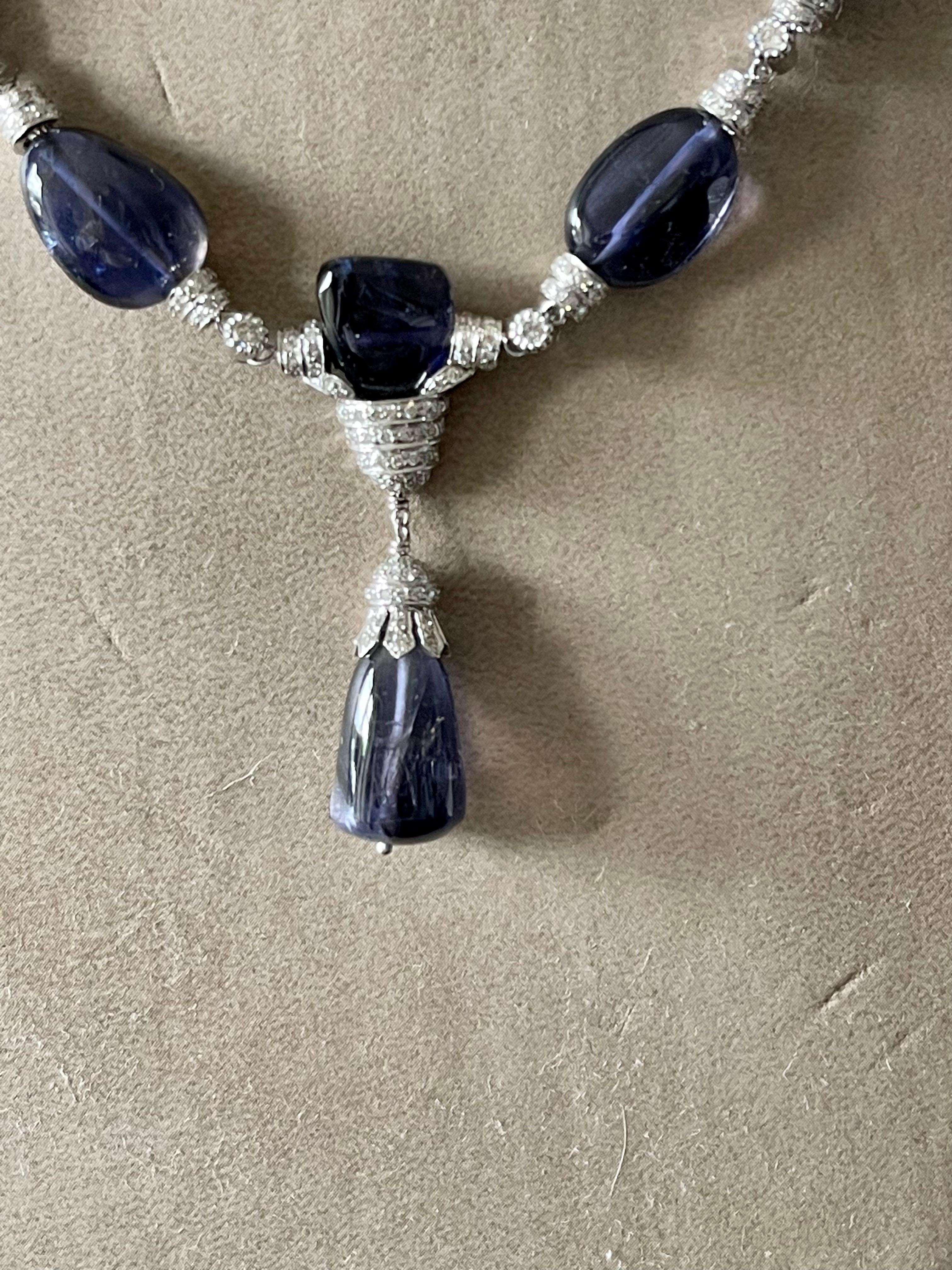Simple yet striking this Art Deco Style 18 K white Gold Necklace featruing 19 violet blue Iolites Beads and additionally decorated with 277 round brillinat cut Diamonds weighing 2.62 ct. 
Masterfully handcrafted piece! Authenticity and money back is