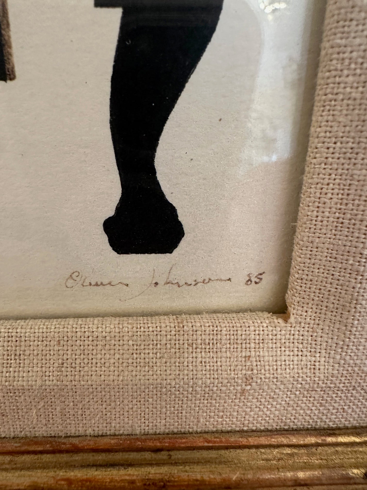 Striking pen and ink art in black and white of a neoclassical armchair and ocelot cat.  Handsomely framed in linen and framed in giltwood.  Signed and dated lower right, Oliver Johnson.