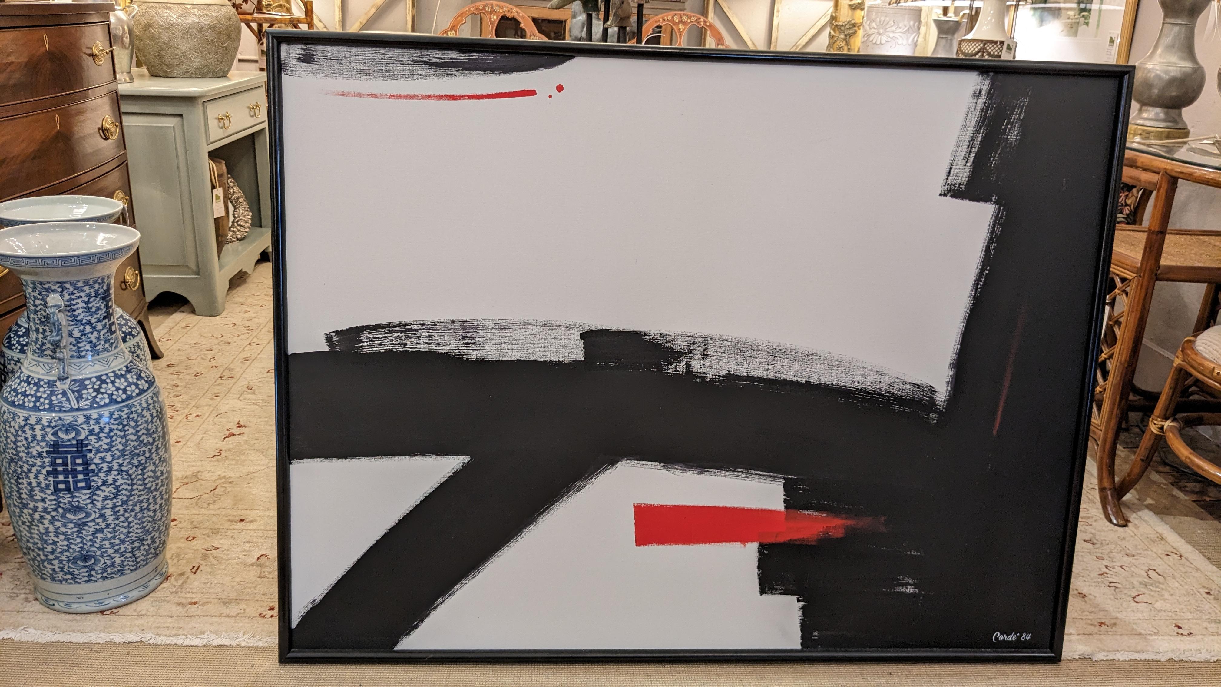 Striking bold abstract painting signed Carde 1984, having slashes of 
black and white and a comet flash of red. Framed in a light
weight black plastic frame typical of the time period.