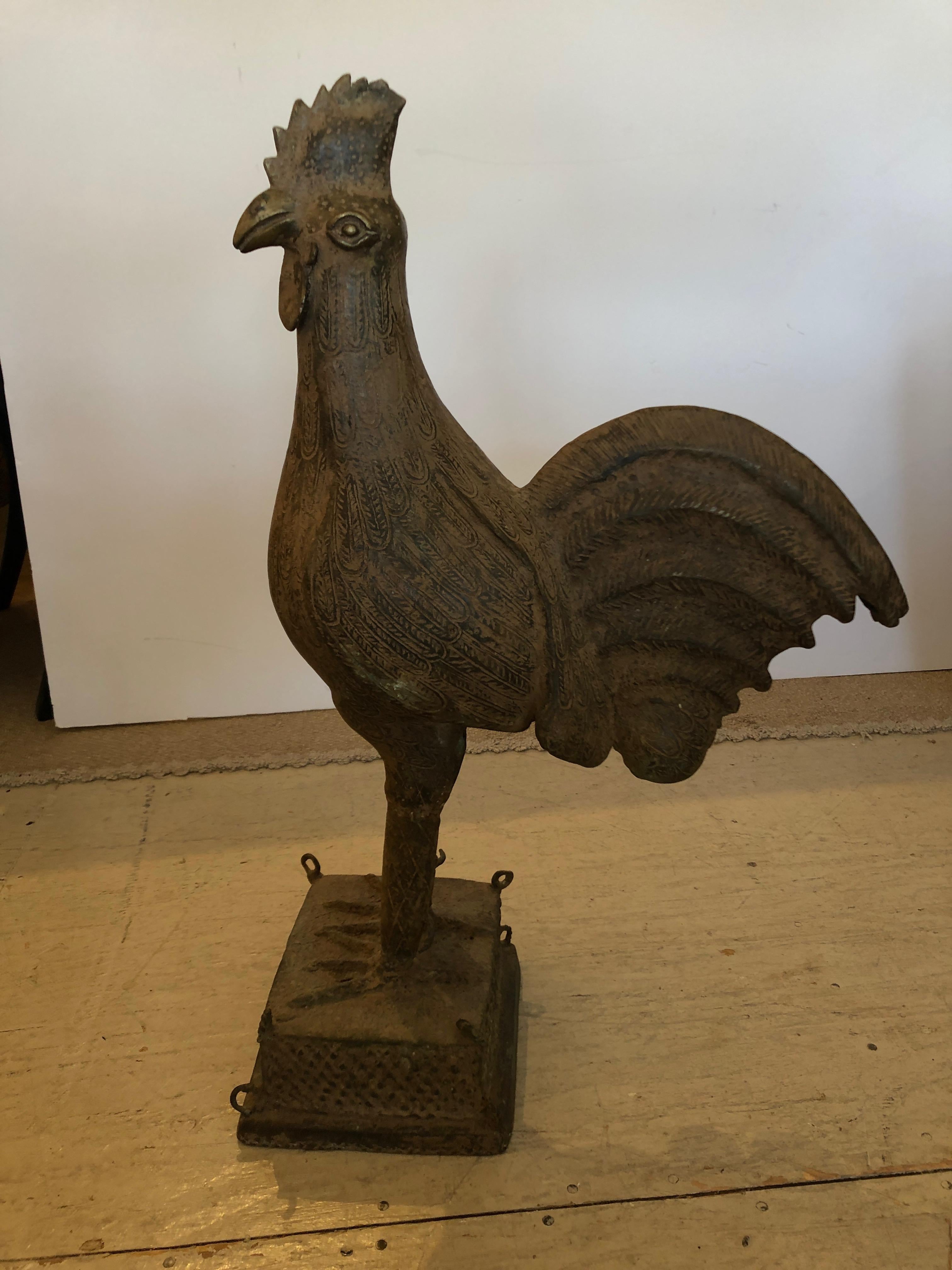 A striking bronze rooster having wonderful etched details on the body and tail. Base is 9 inches square.