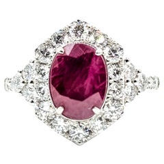Striking Burma Ruby 
Diamond Halo Ring in Platinum