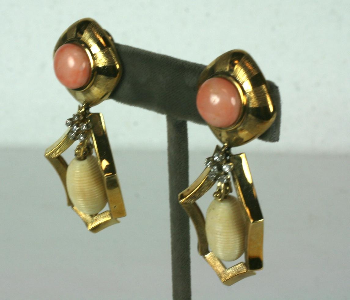 Striking and Elegant Coral, Bone and Diamond Pendant Earrings from the 1970's. Heavy quality 18k gold manufacture appears to be custom made in the period. 
A large creamy coral cabochon is used for ear top. Within the earring pendant there is a