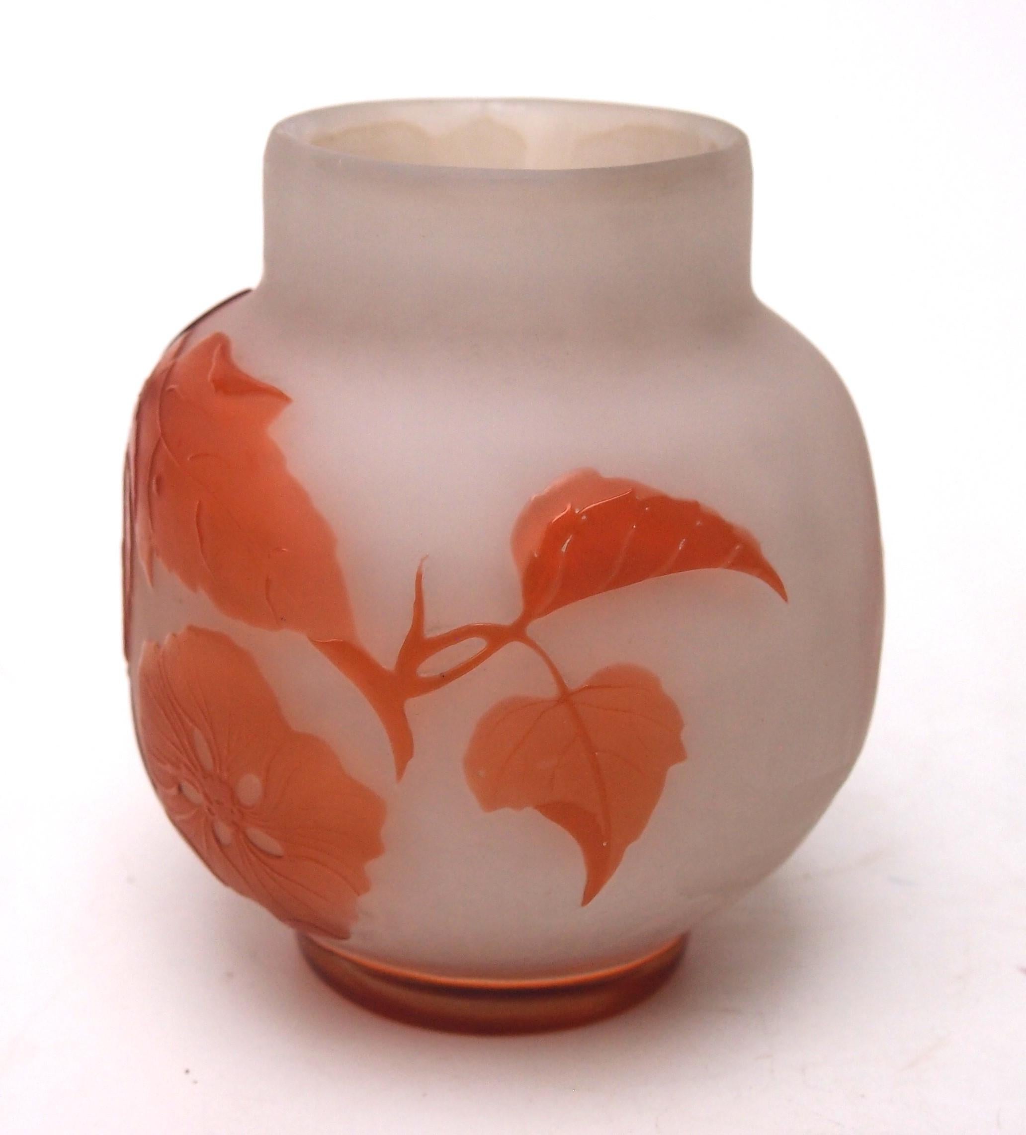 Unusual and early two colour Emile Galle cameo botanical vase in orange over opaque white (not as is appears just orange over clear). Depicting fine summer blooms. Very unusually, the vase is signed to the rear inside one of the blooms -the last