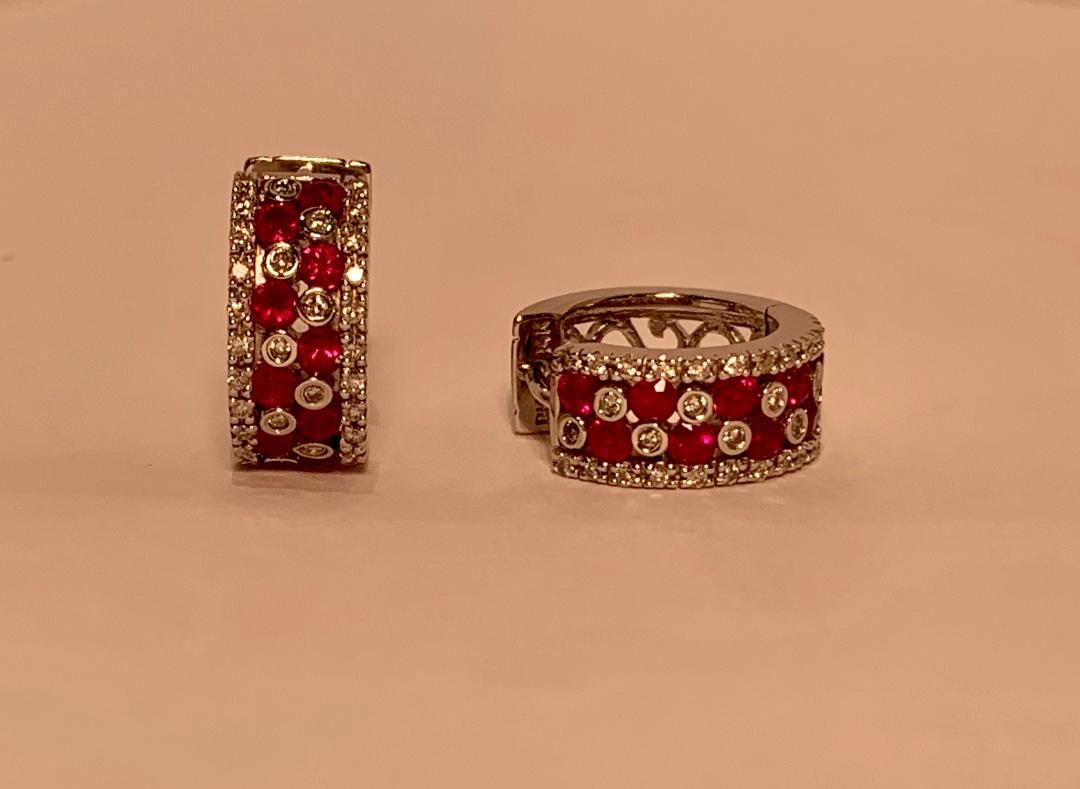 Very stylish ladies 14 karat white gold designer “Effy” ruby and diamond  hoop silhouette earrings feature a striking checkerboard design accented with a diamond border on each side. The rubies are the most beautiful vivid red color and are very