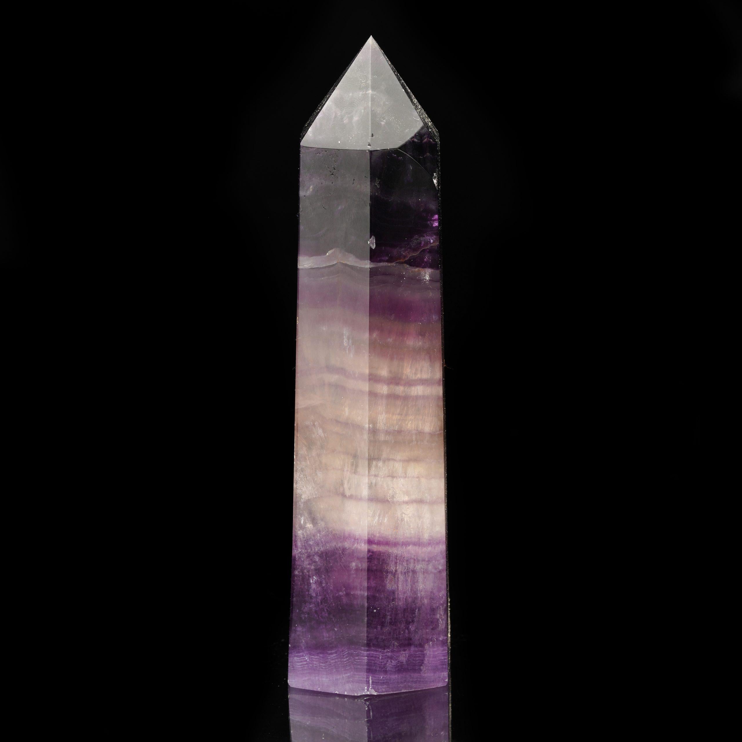 This impressive Fluorite obelisk, sourced from China, showcases the enchanting hues and translucent qualities characteristic of high-grade Fluorite. The mineral’s natural color zoning, combined with its reputation for enhancing mental clarity and