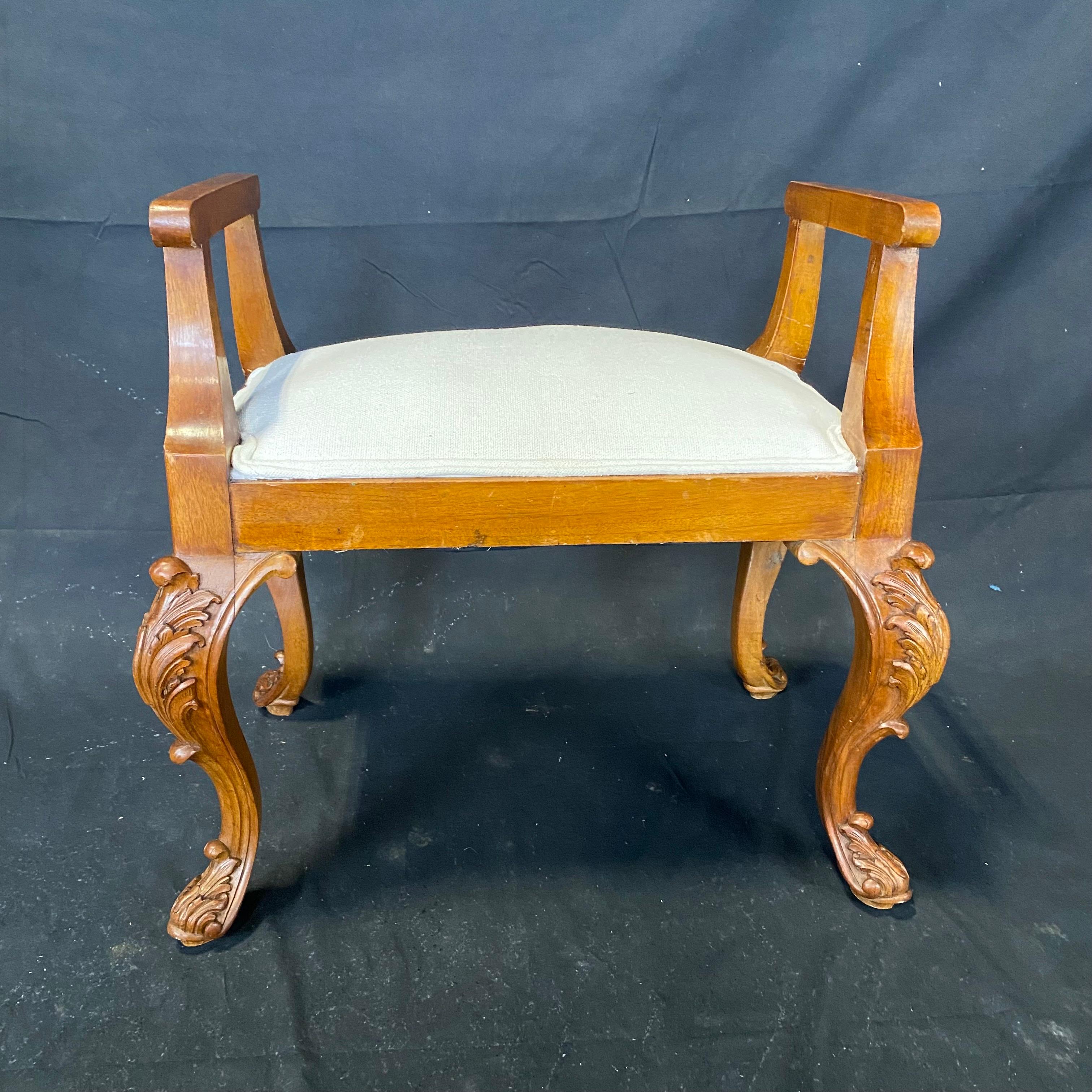 Newly reupholstered in a beautiful linen cotton blend, this lovely French walnut chair and ottoman set displays classic Louis XV hand carved detail. Can be used separately or together, but creates a lovely low profile comfortable chaise like