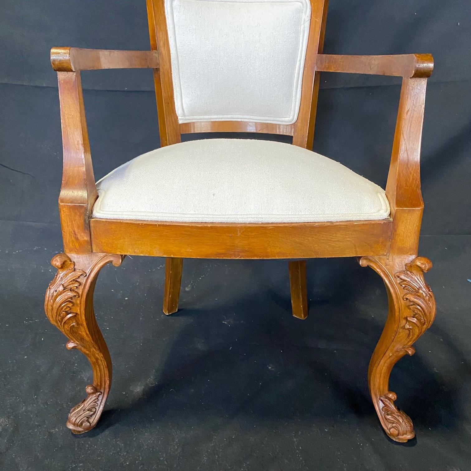 Early 20th Century  Striking French Louis XV Carved Walnut Chair and Ottoman Set For Sale