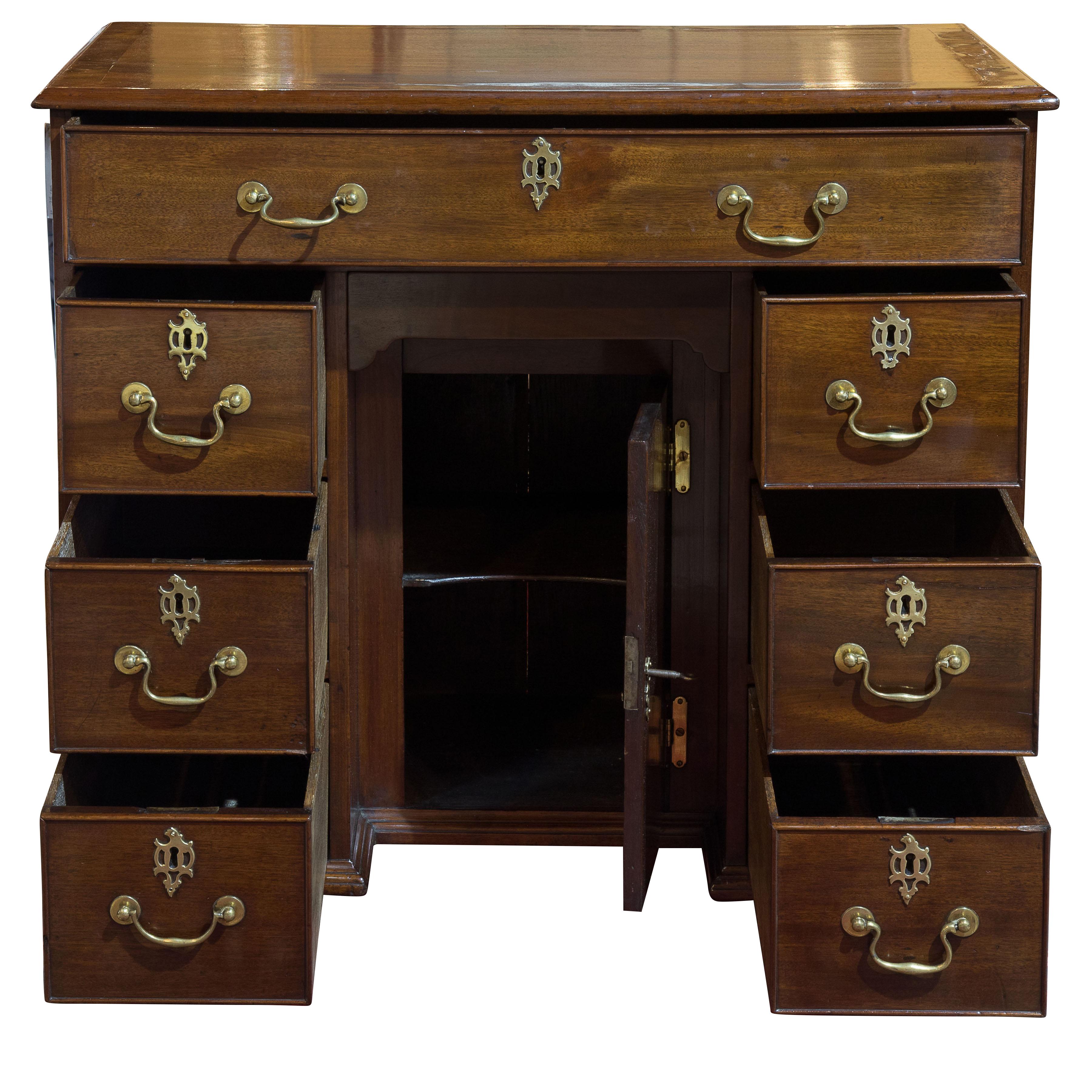 Striking George III mahogany kneehole desk with original hardware.